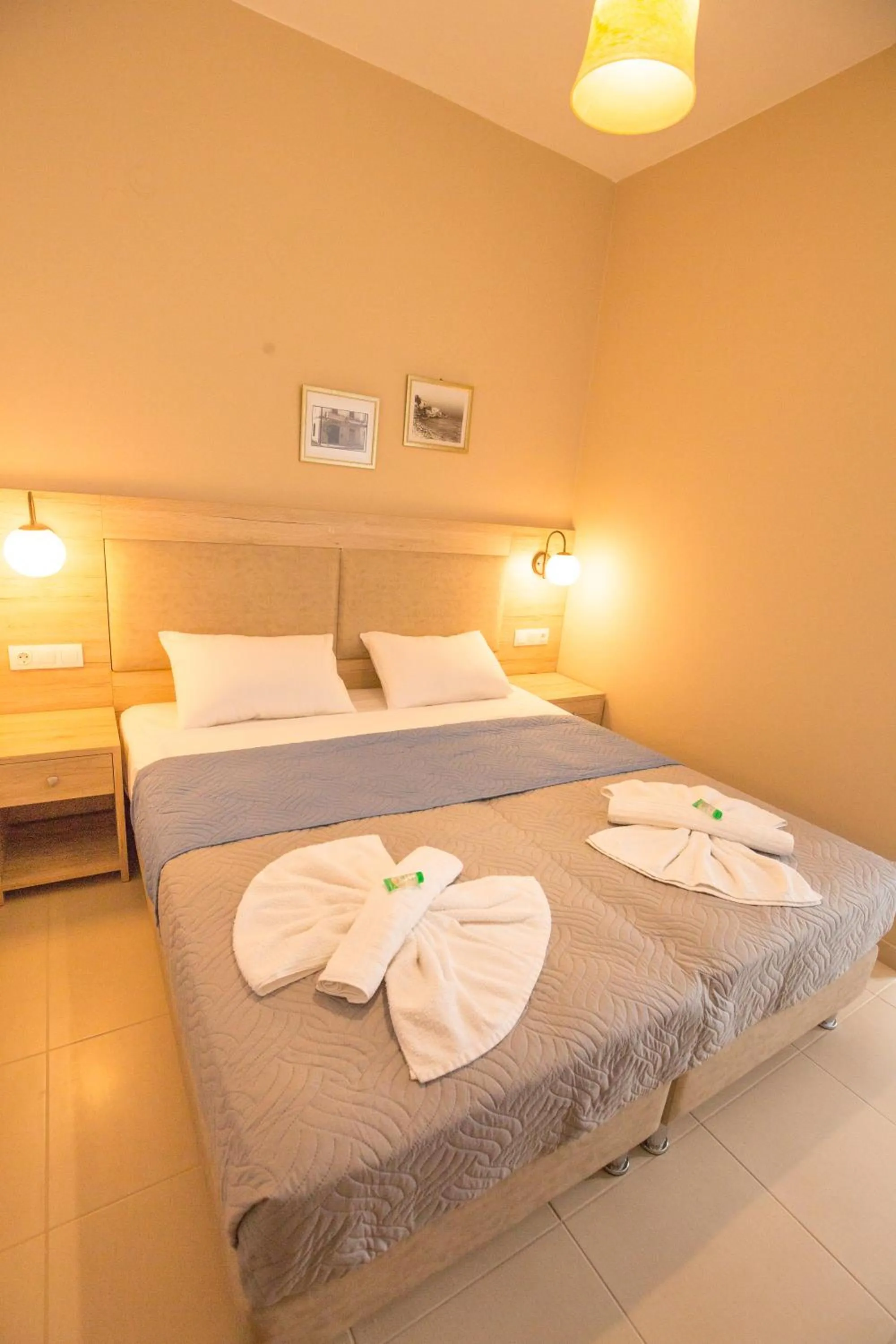 Bed in Mastorakis Hotel and Studios