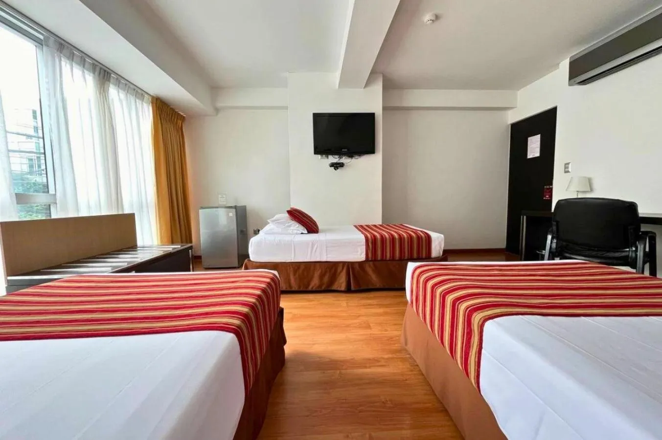 Bed in Allpa Hotel & Suites