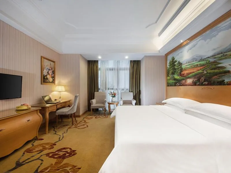 Bed in Vienna International Hotel Fuzhou Cangshan Wanda