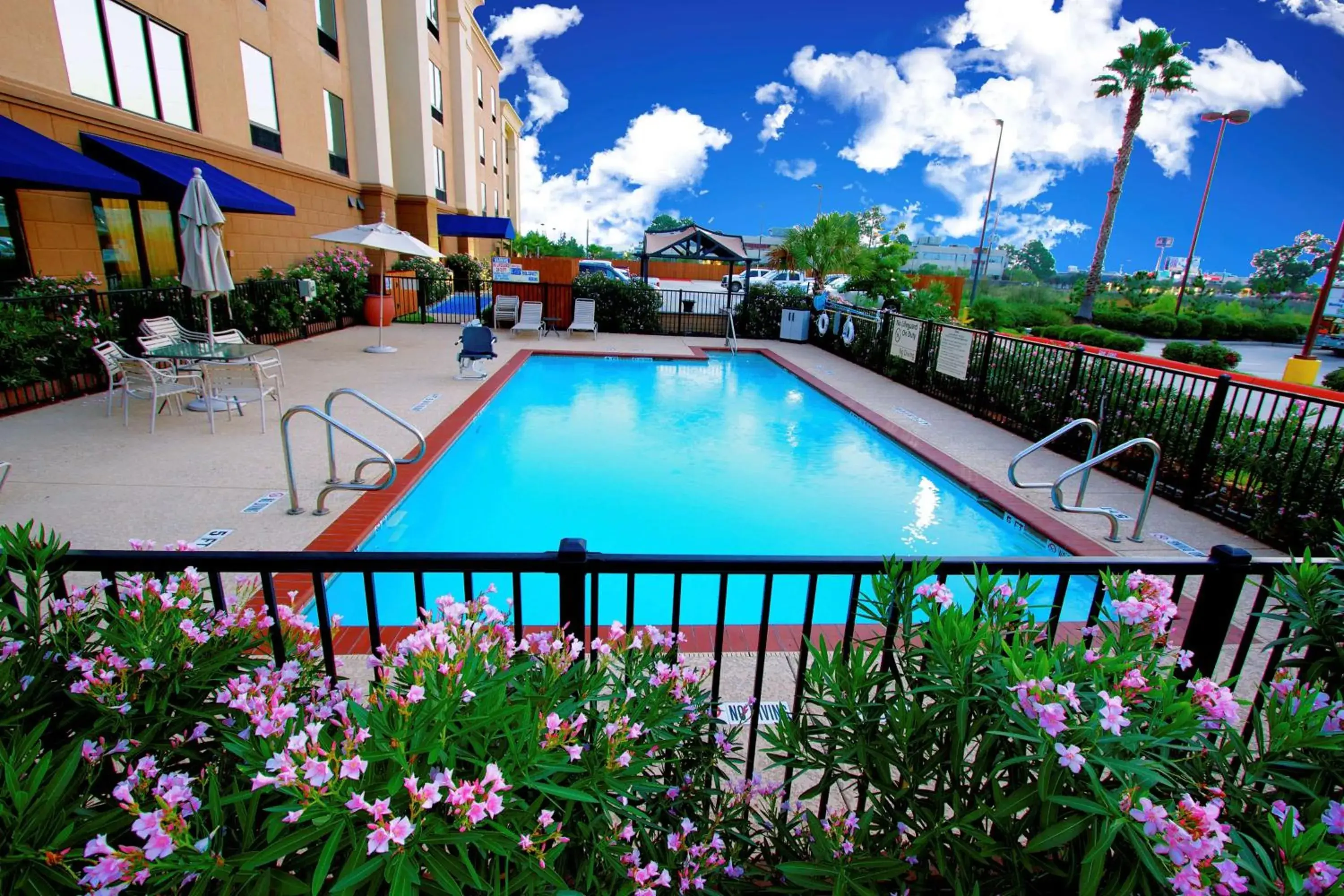 Pool view in Hampton Inn & Suites by Hilton Tomball Houston NW Pool view in Hampton Inn & Suites by Hilton Tomball Houston NW