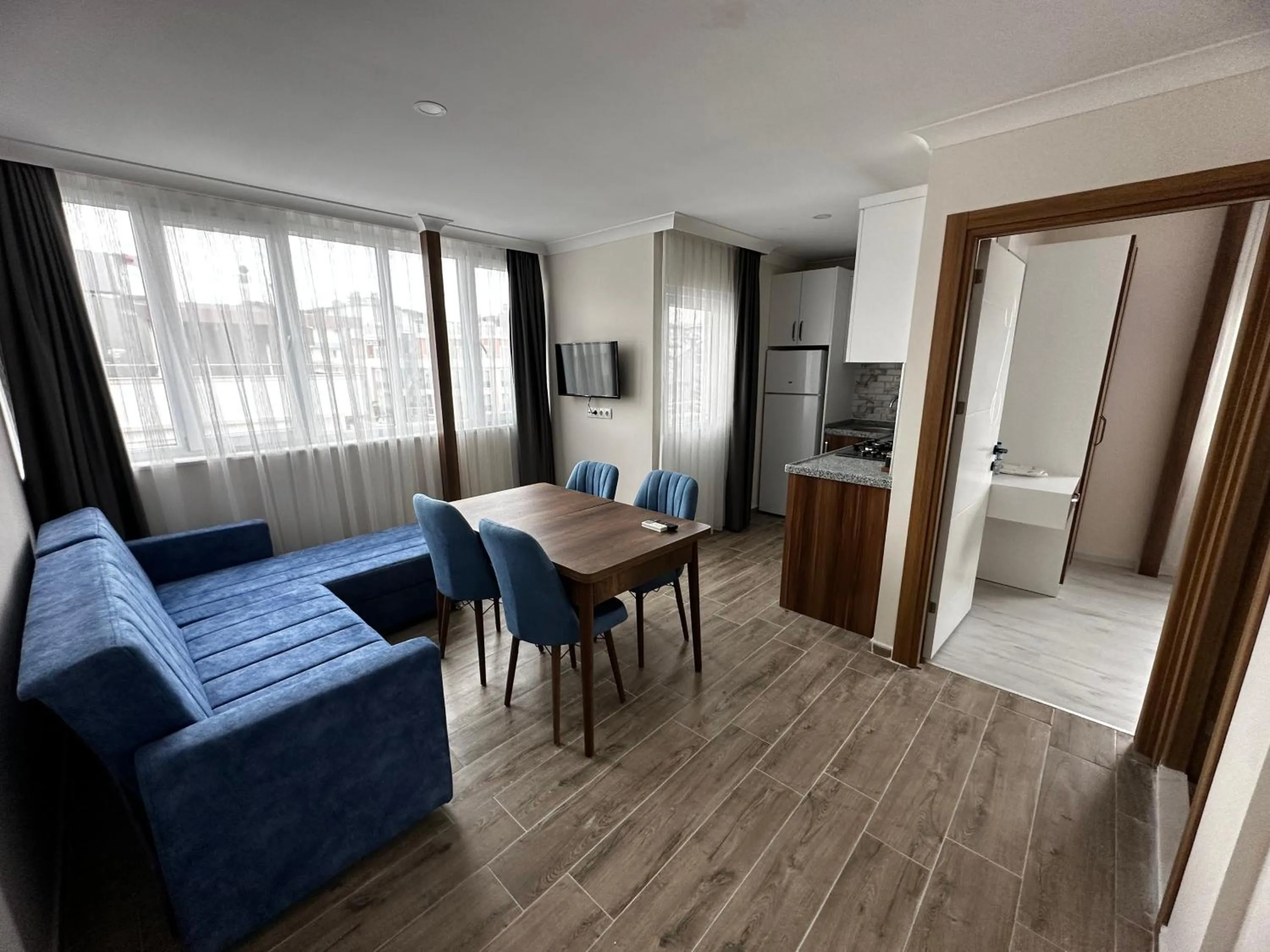 Living room, Dining Area in Theluna City Hotel