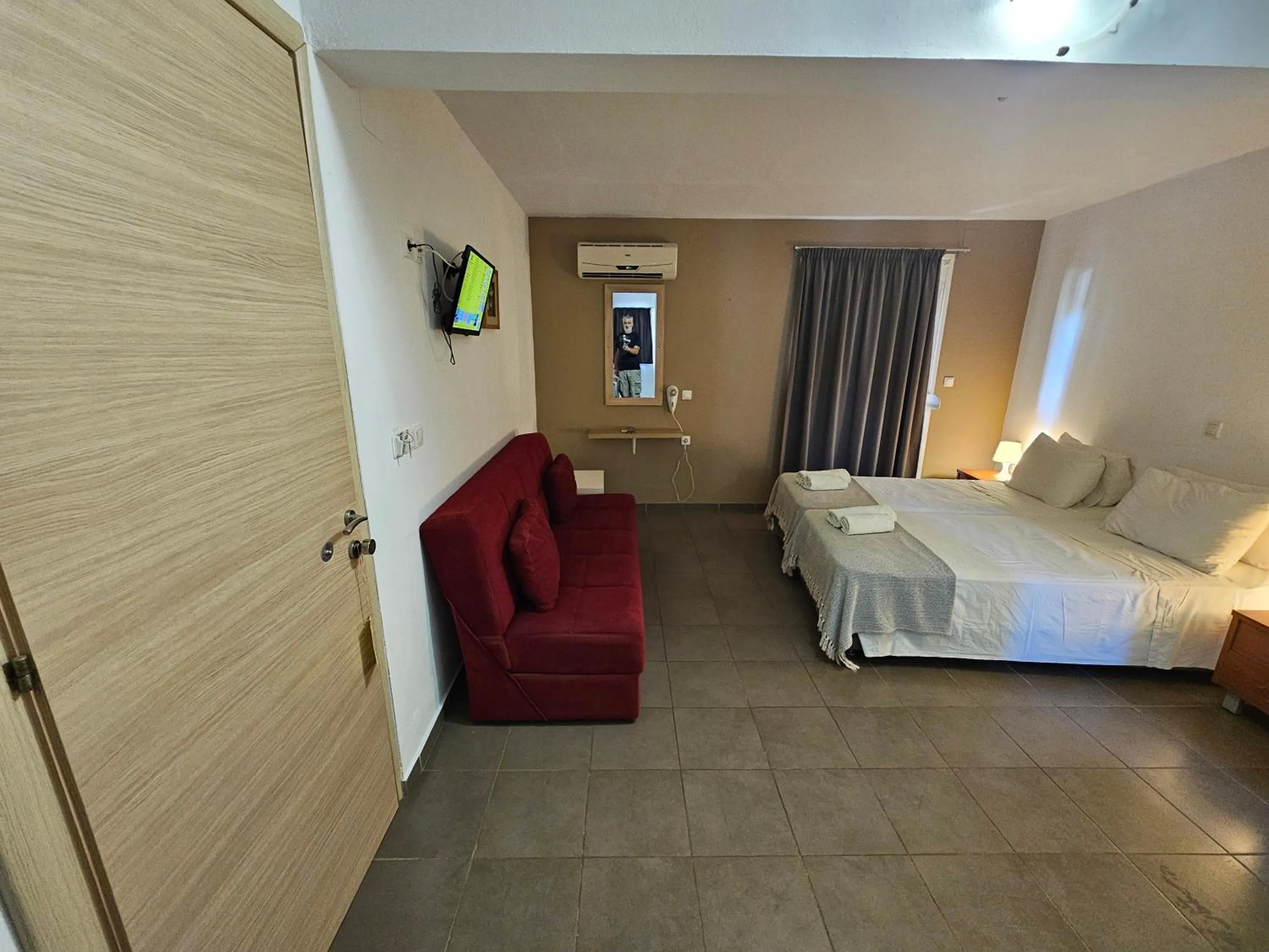 Bed in Elounda Sunrise Apartments