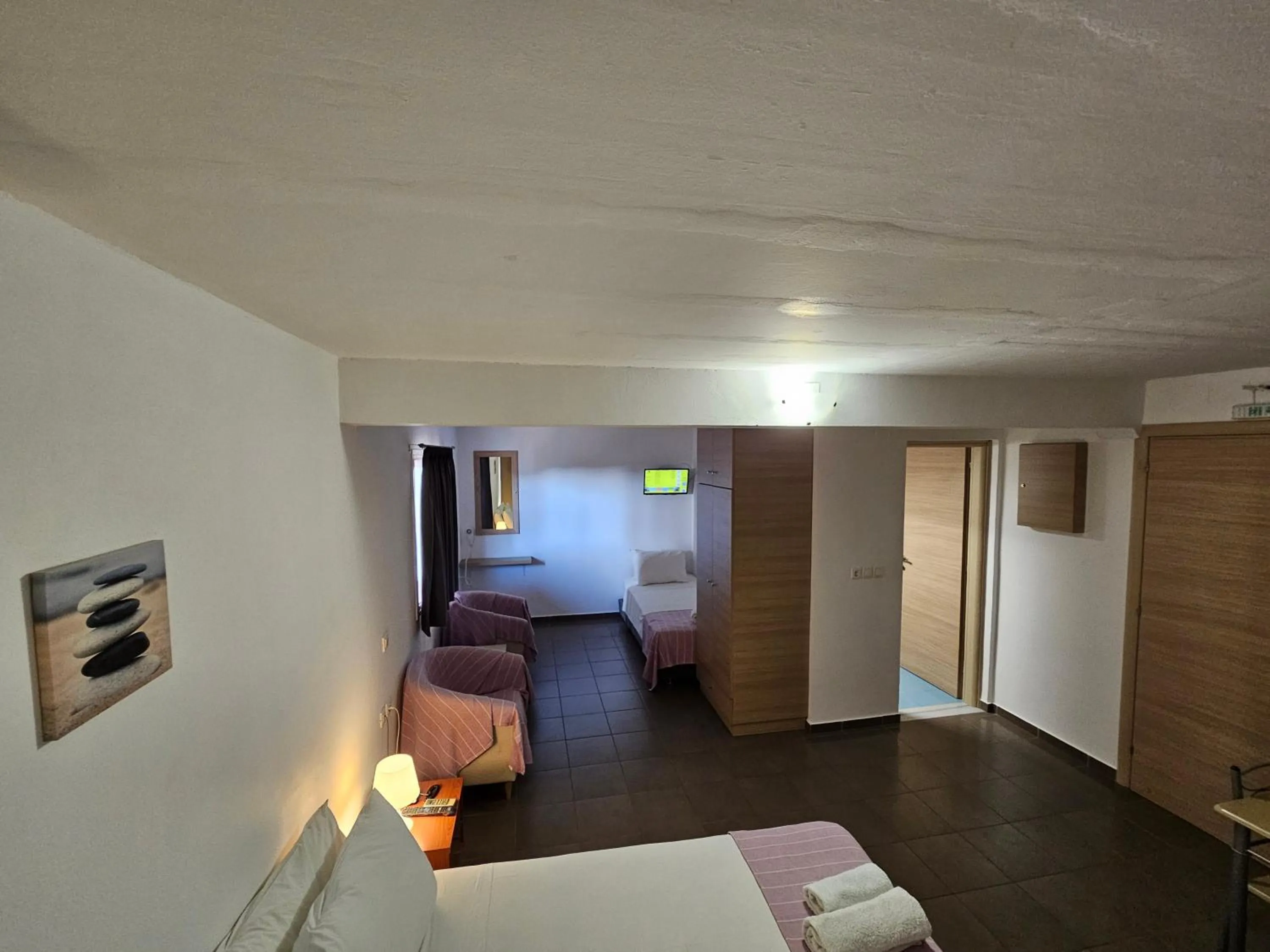 Bed in Elounda Sunrise Apartments