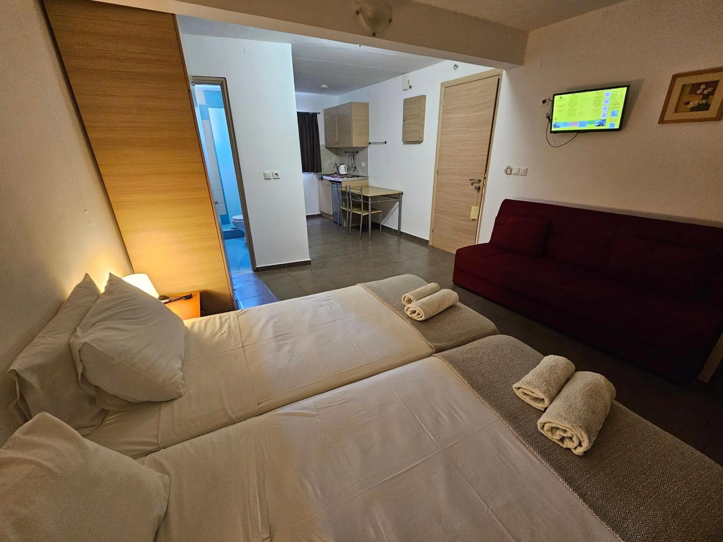 Bed in Elounda Sunrise Apartments