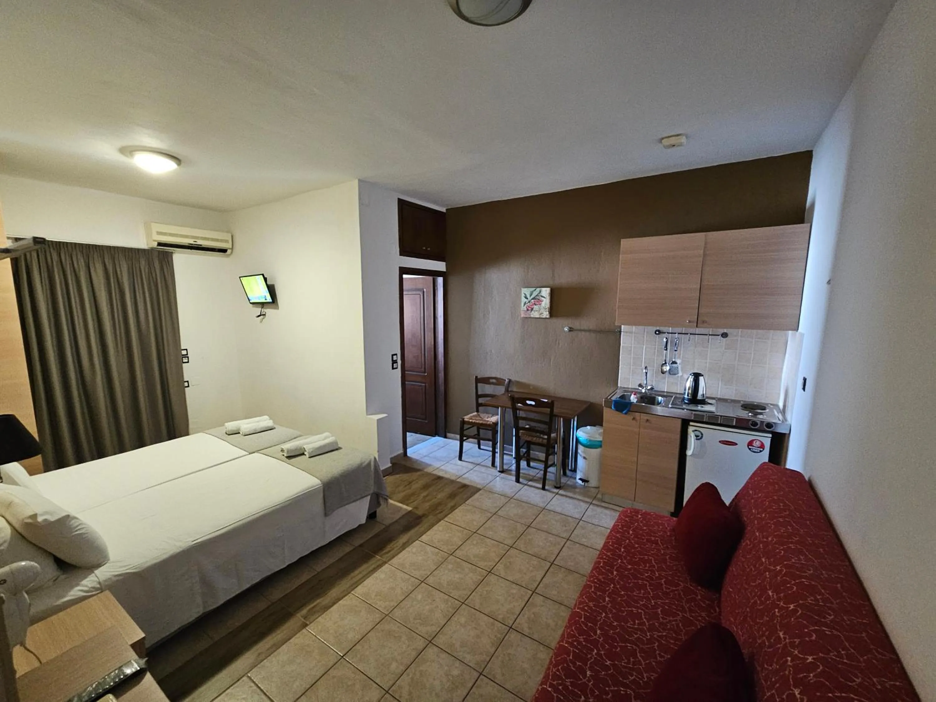 Kitchen or kitchenette, Bed in Elounda Sunrise Apartments