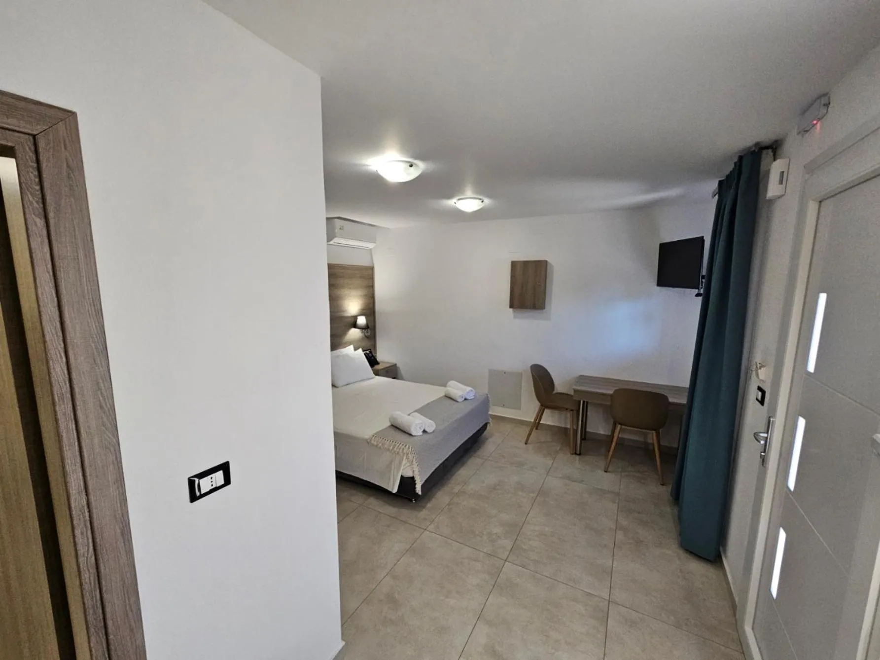 Bed in Elounda Sunrise Apartments