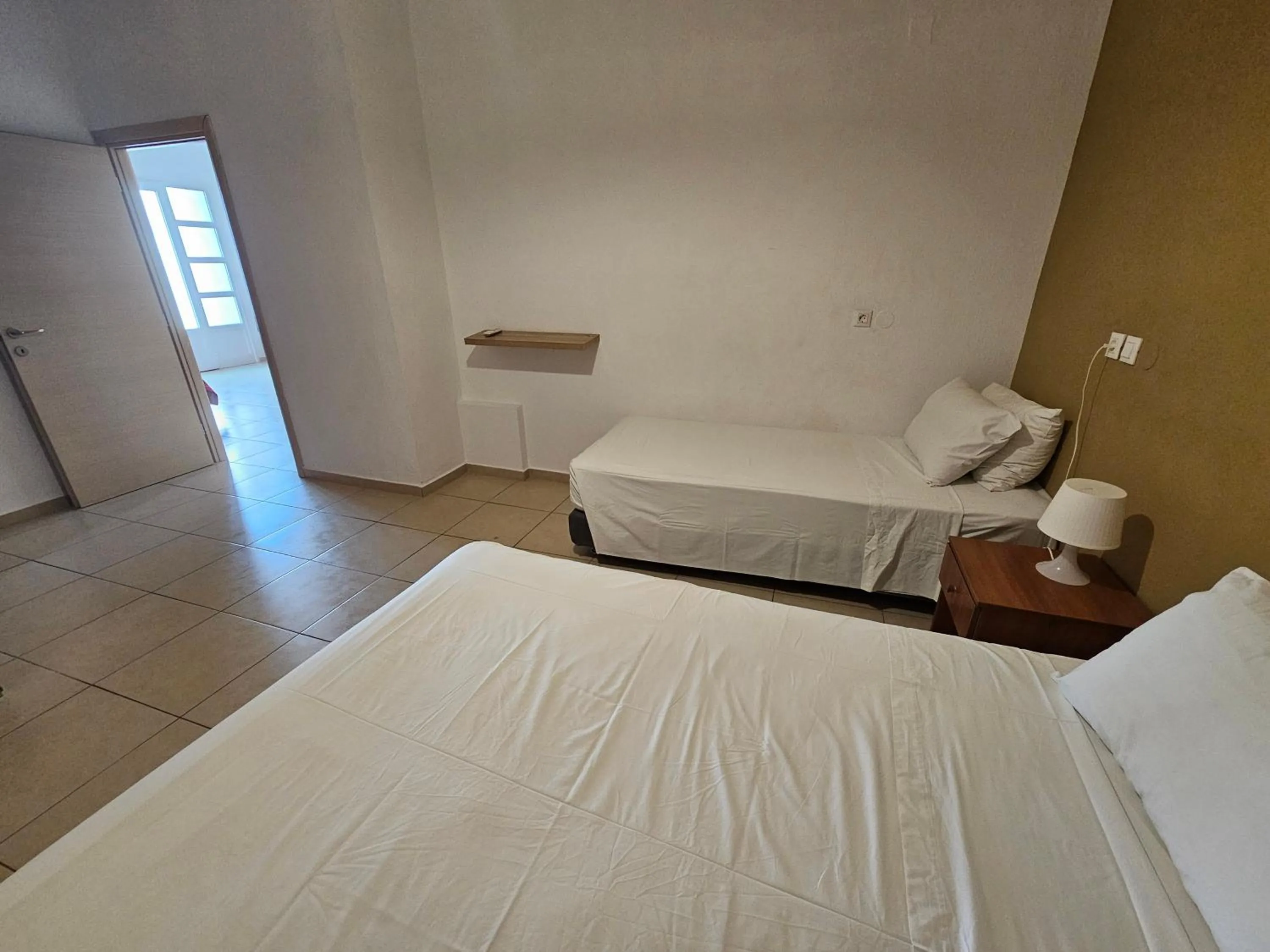 Bed in Elounda Sunrise Apartments