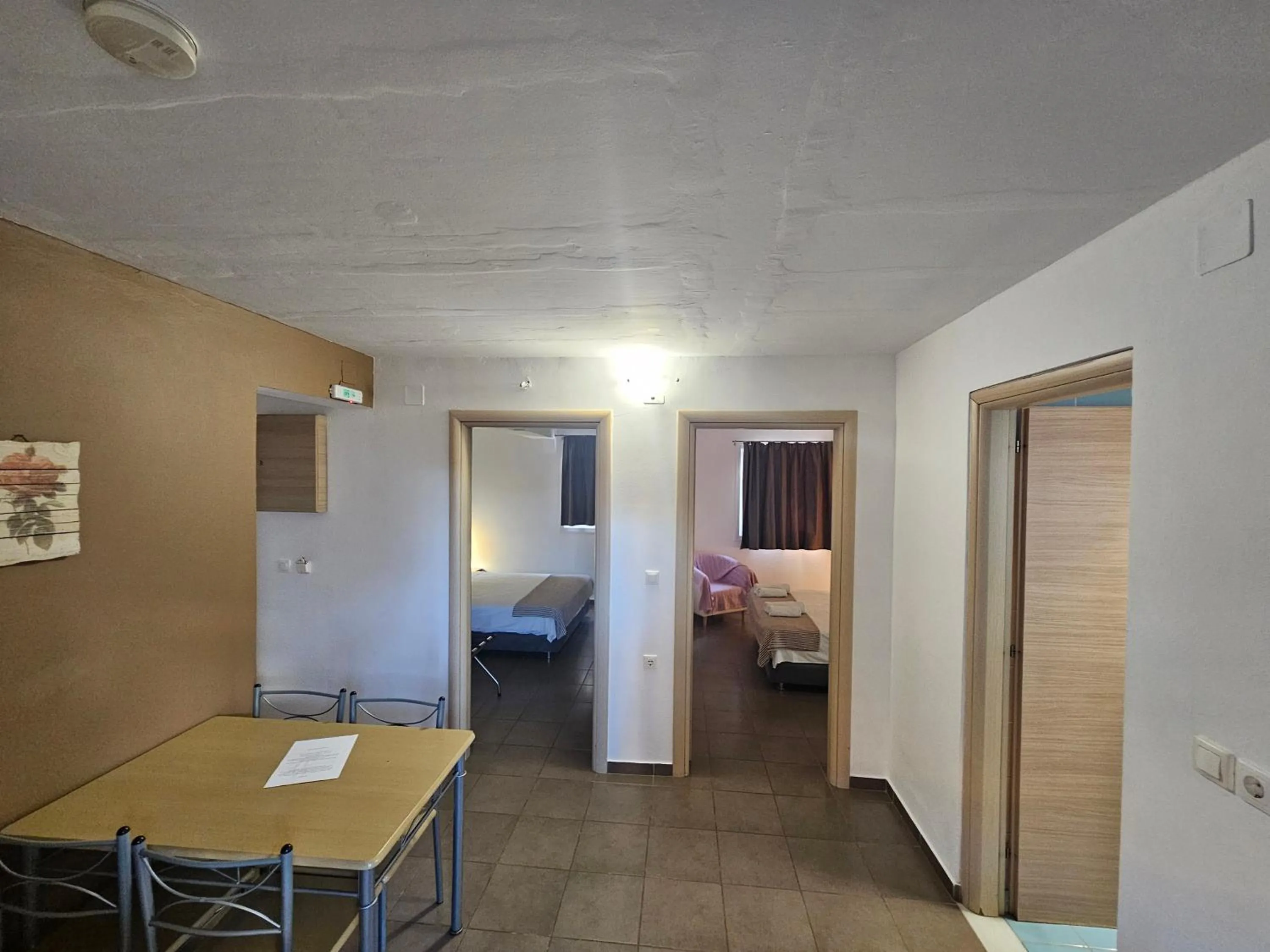 Bed in Elounda Sunrise Apartments