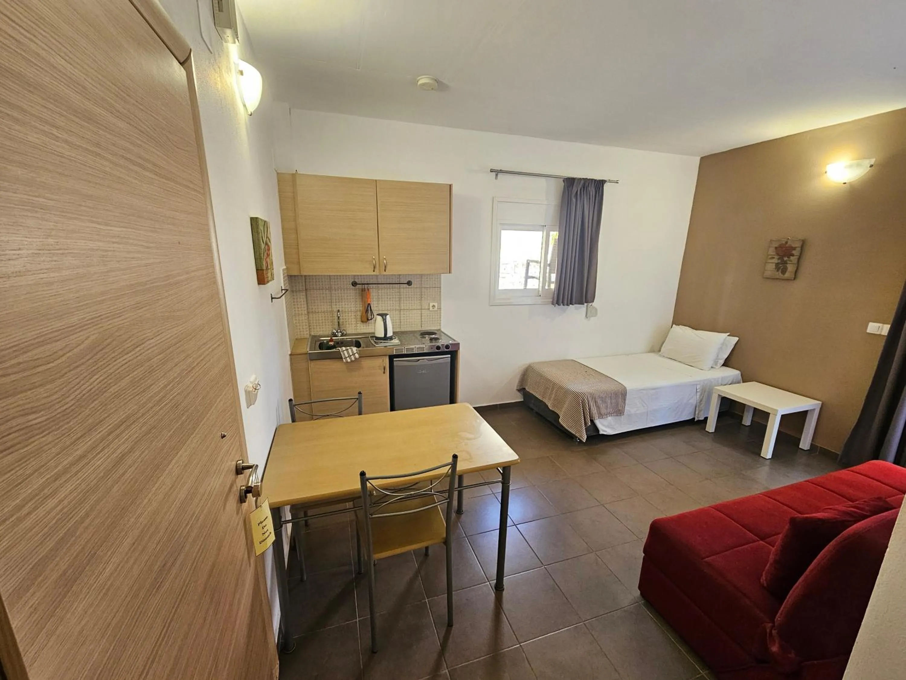 Kitchen or kitchenette, Bed in Elounda Sunrise Apartments