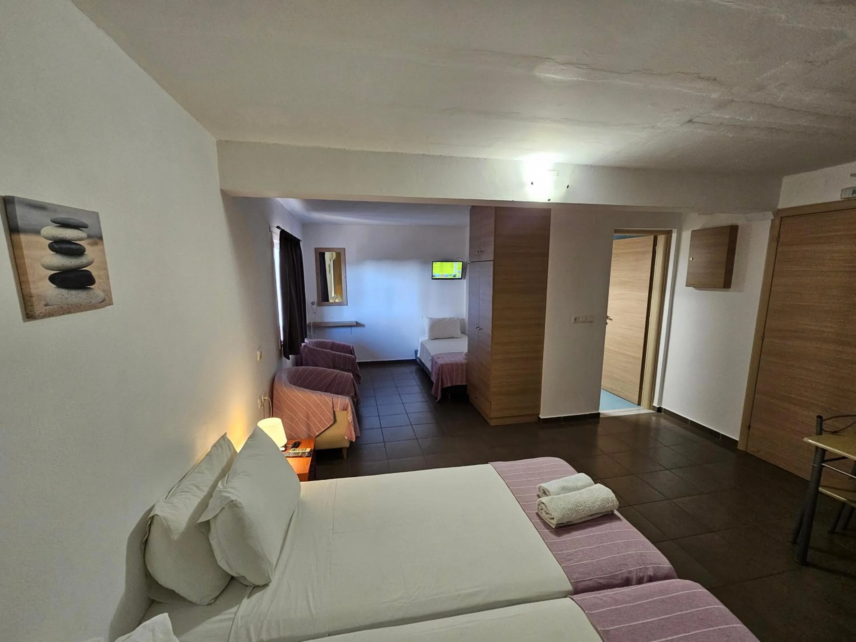 Bed in Elounda Sunrise Apartments