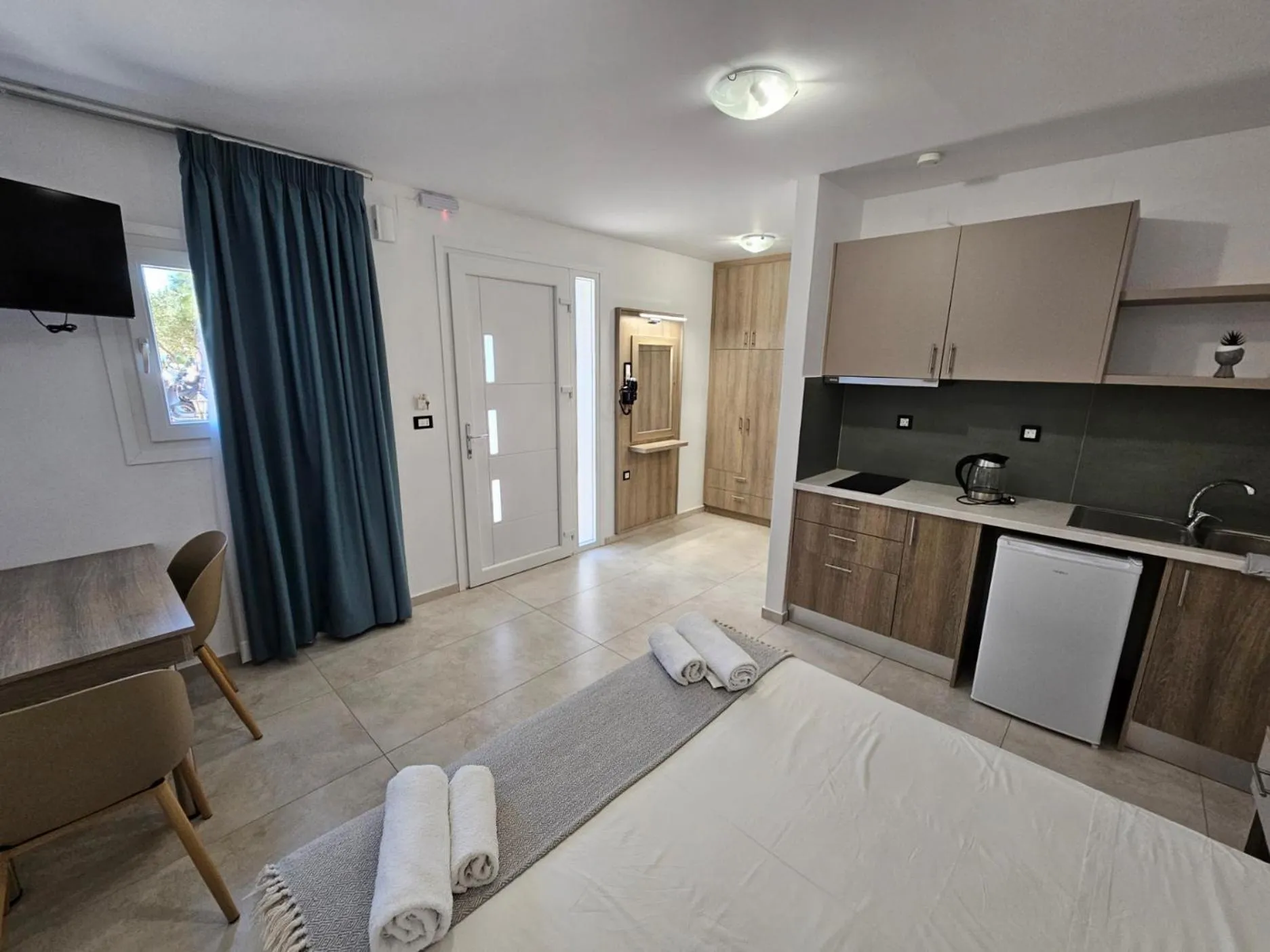 Bed in Elounda Sunrise Apartments