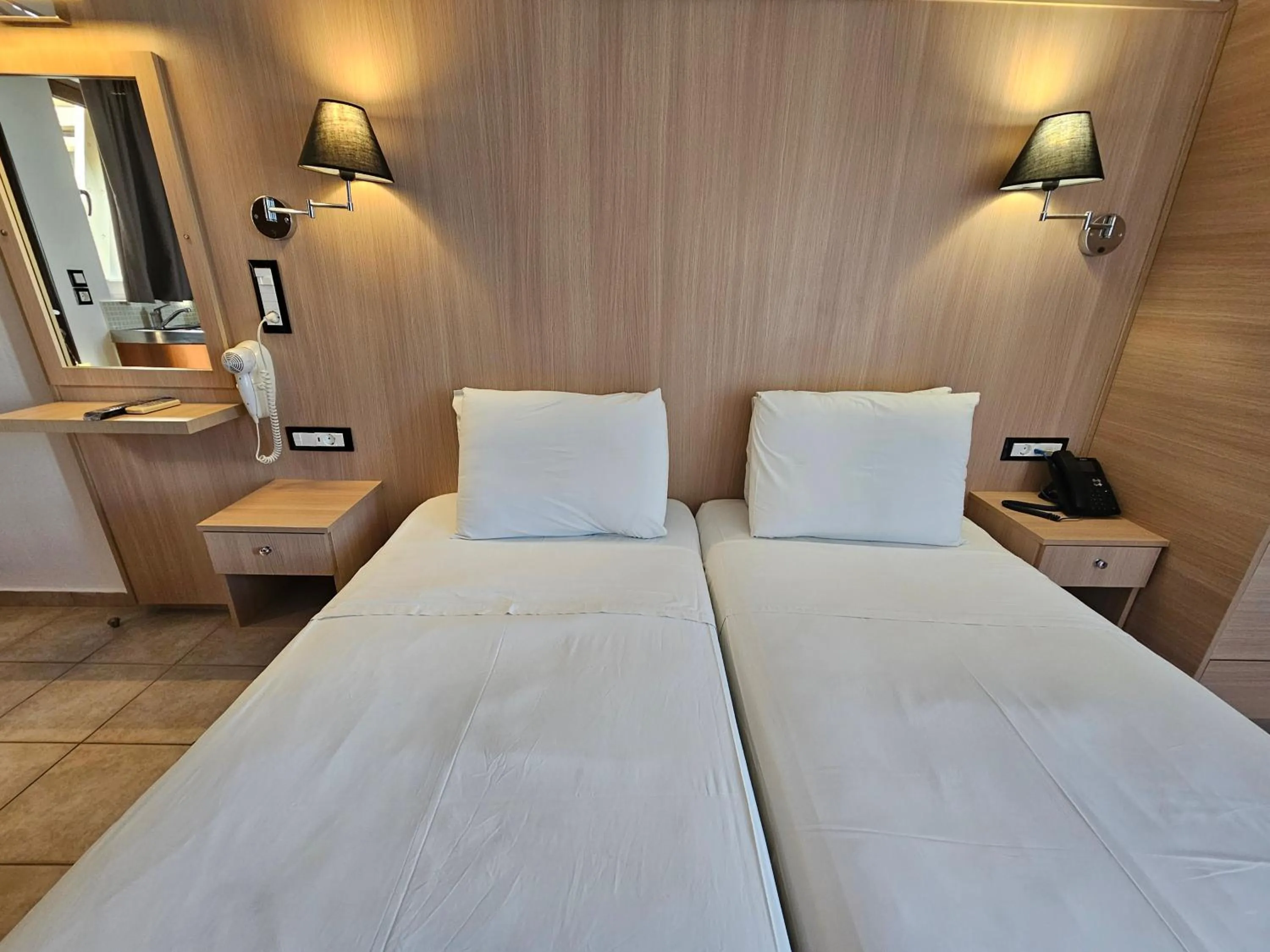 Bed in Elounda Sunrise Apartments