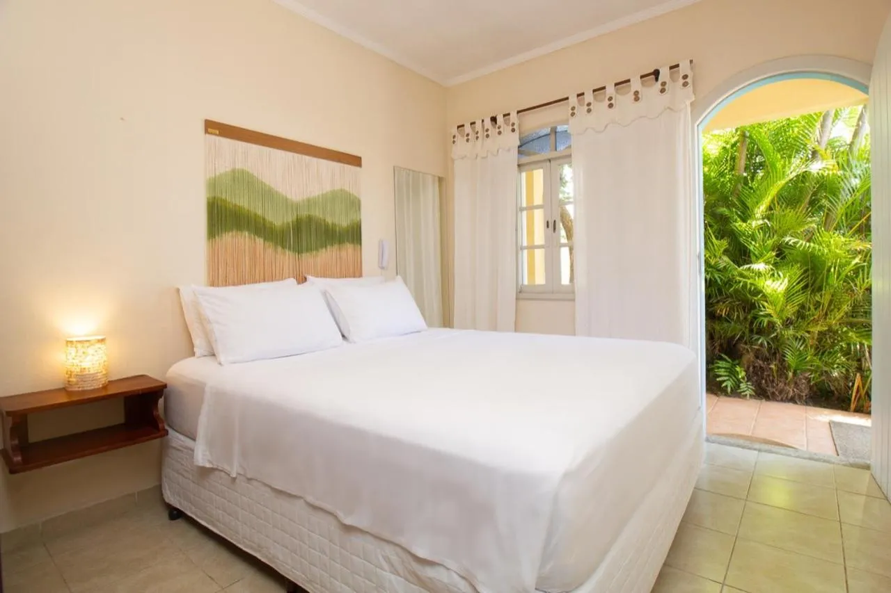 Bed in Pousada Villaggio