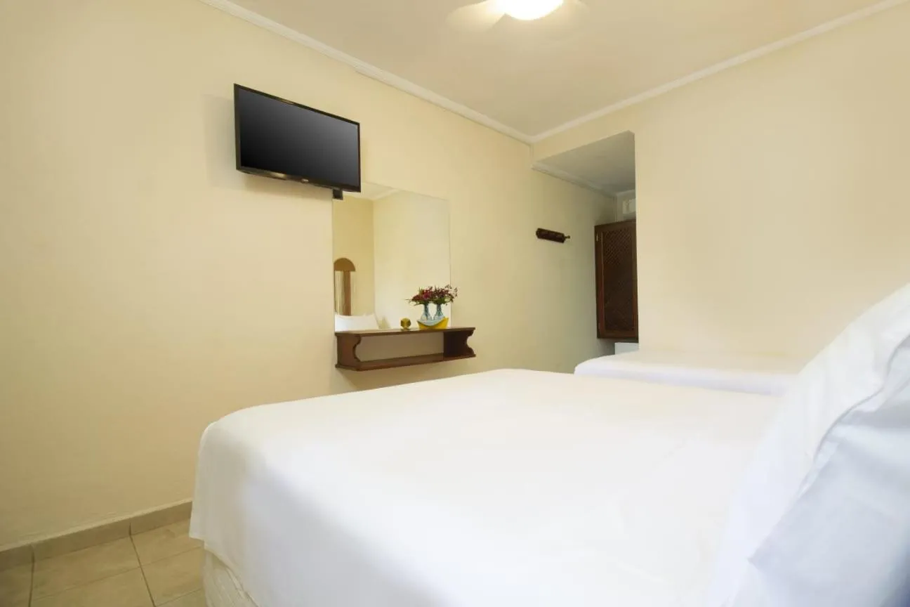 Bed in Pousada Villaggio