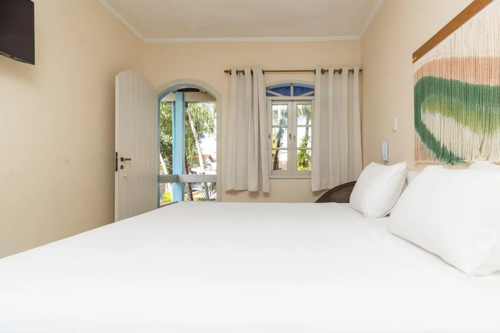 Bed in Pousada Villaggio