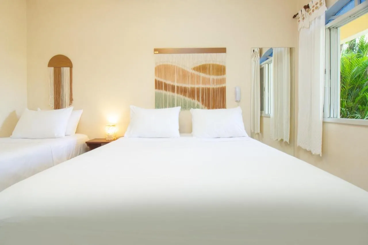 Bed in Pousada Villaggio