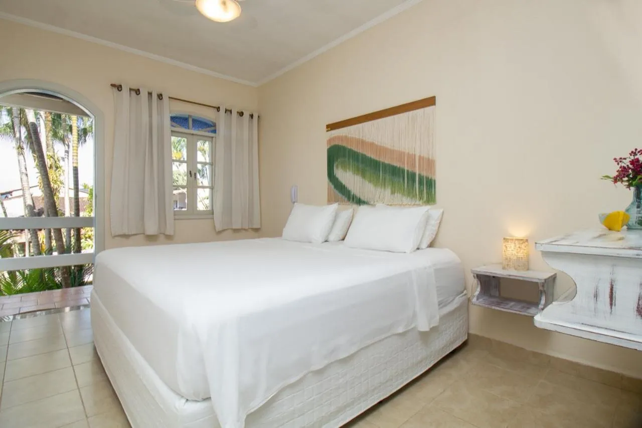 Bed in Pousada Villaggio