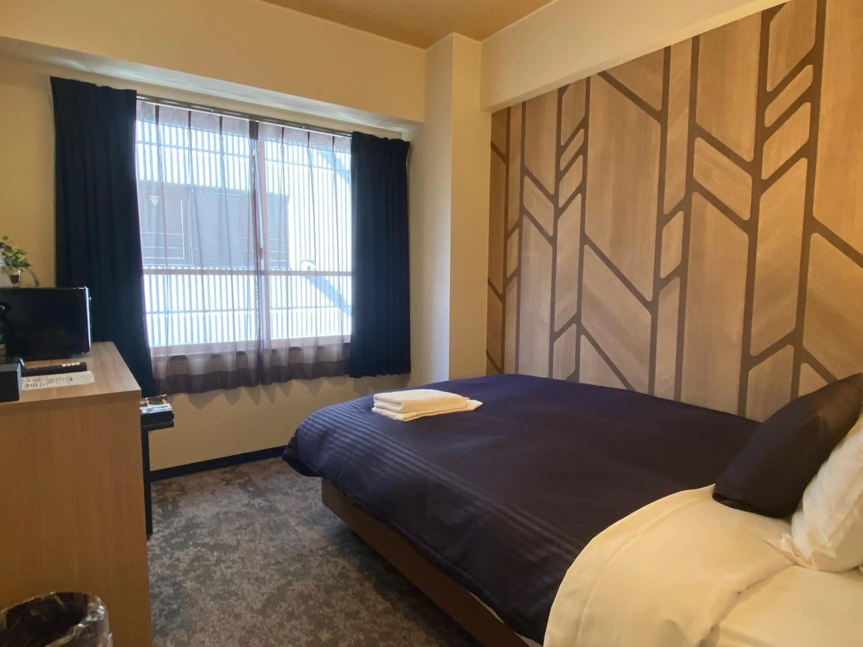 Bed in HOTEL LiVEMAX BUDGET Higashi Ueno