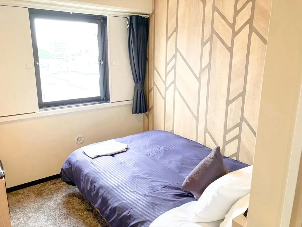 Bed in HOTEL LiVEMAX BUDGET Sagamihara