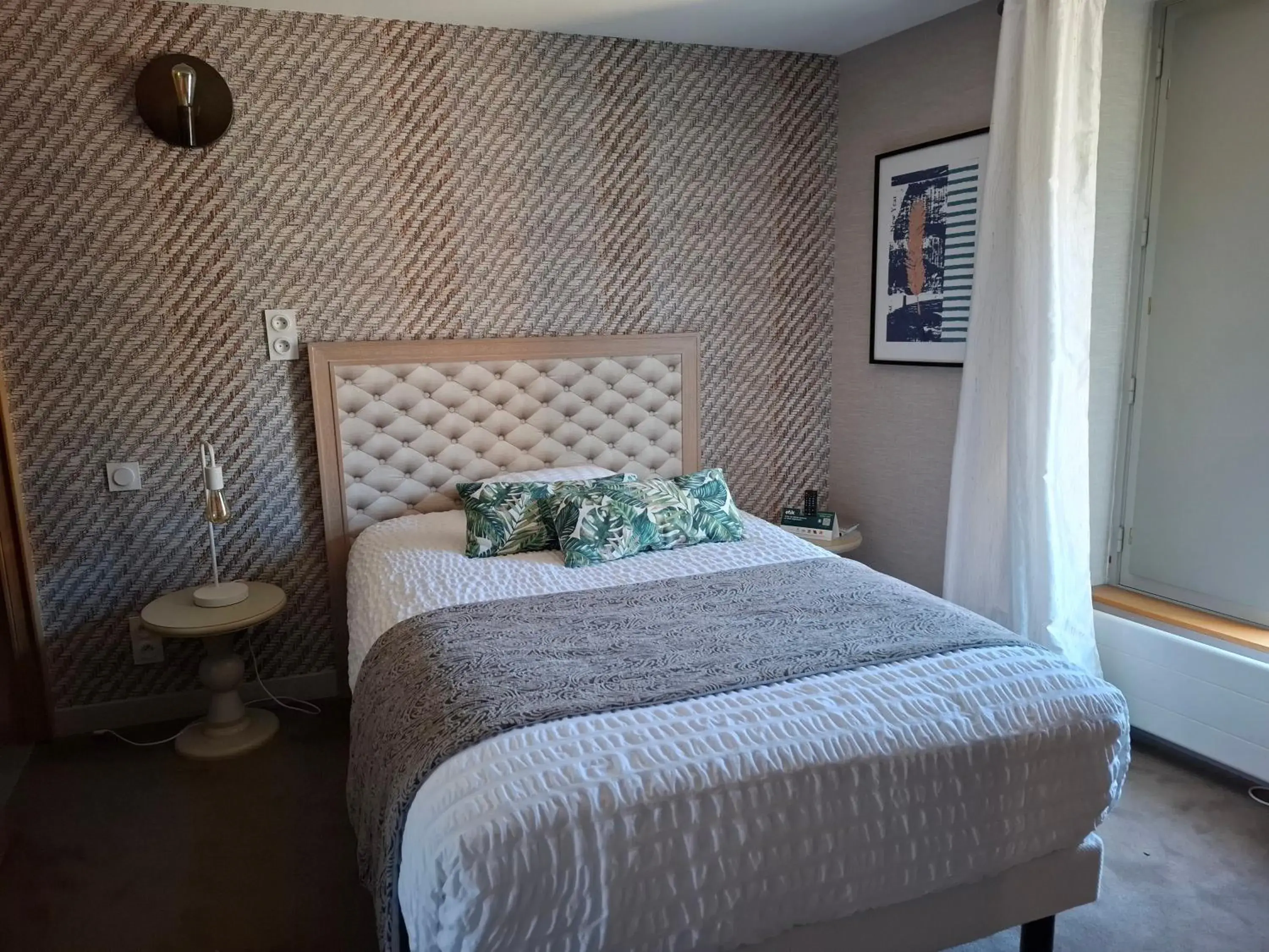 Bed in Logis Hôtel-restaurant Le Grand Cerf Bed in Logis Hôtel-restaurant Le Grand Cerf