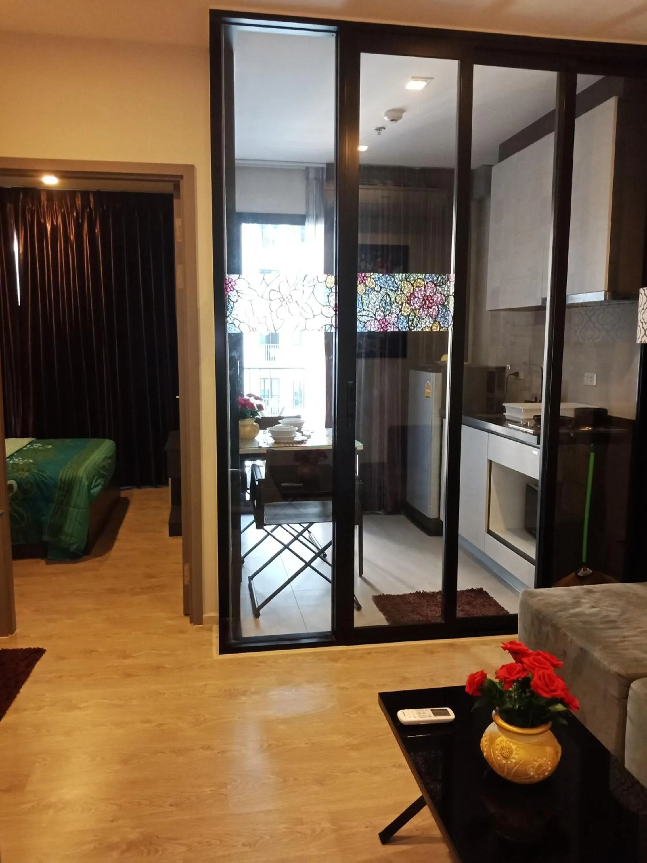 Living room in LLX Apartments at The Base condo