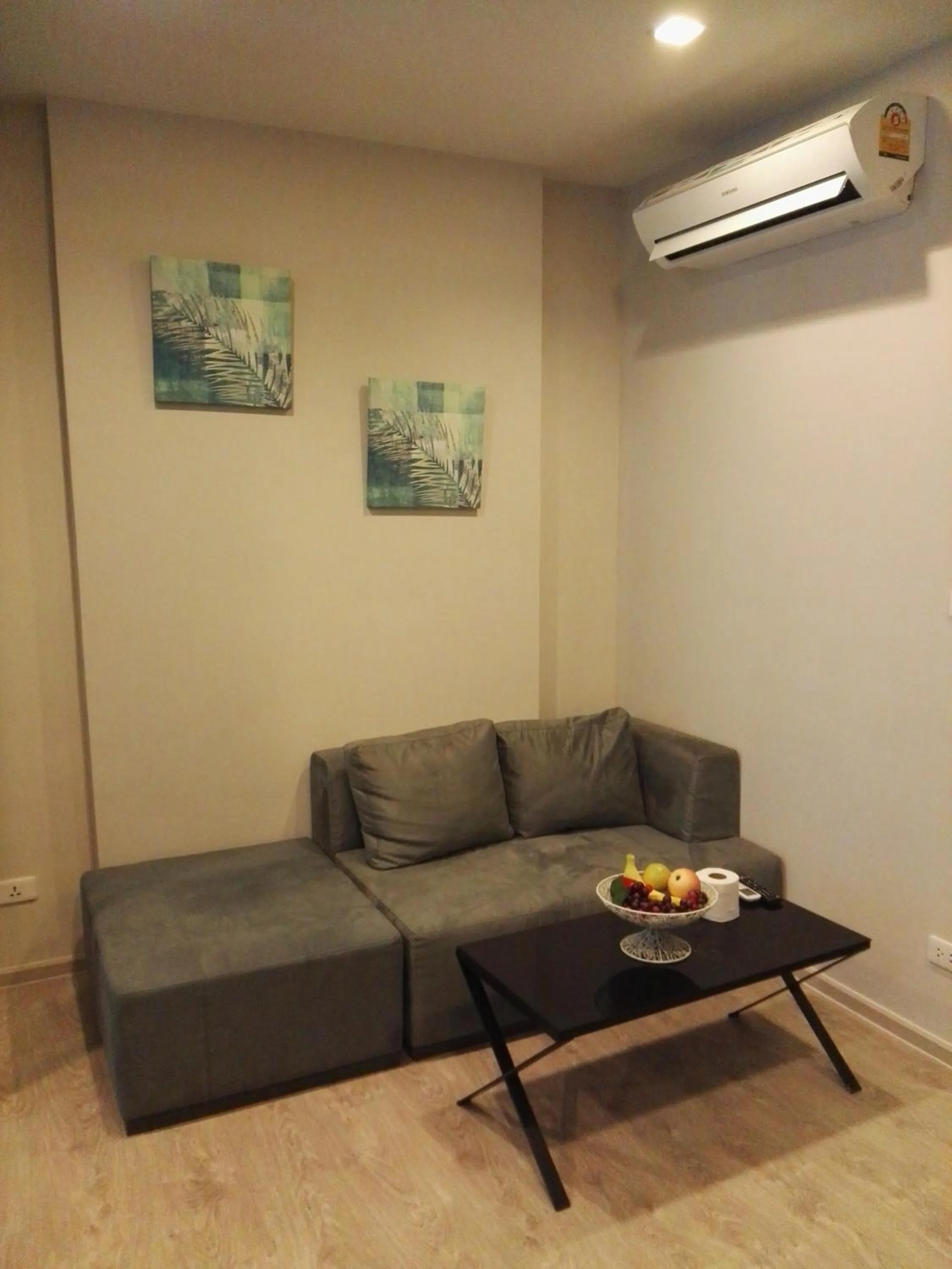 Living room in LLX Apartments at The Base condo