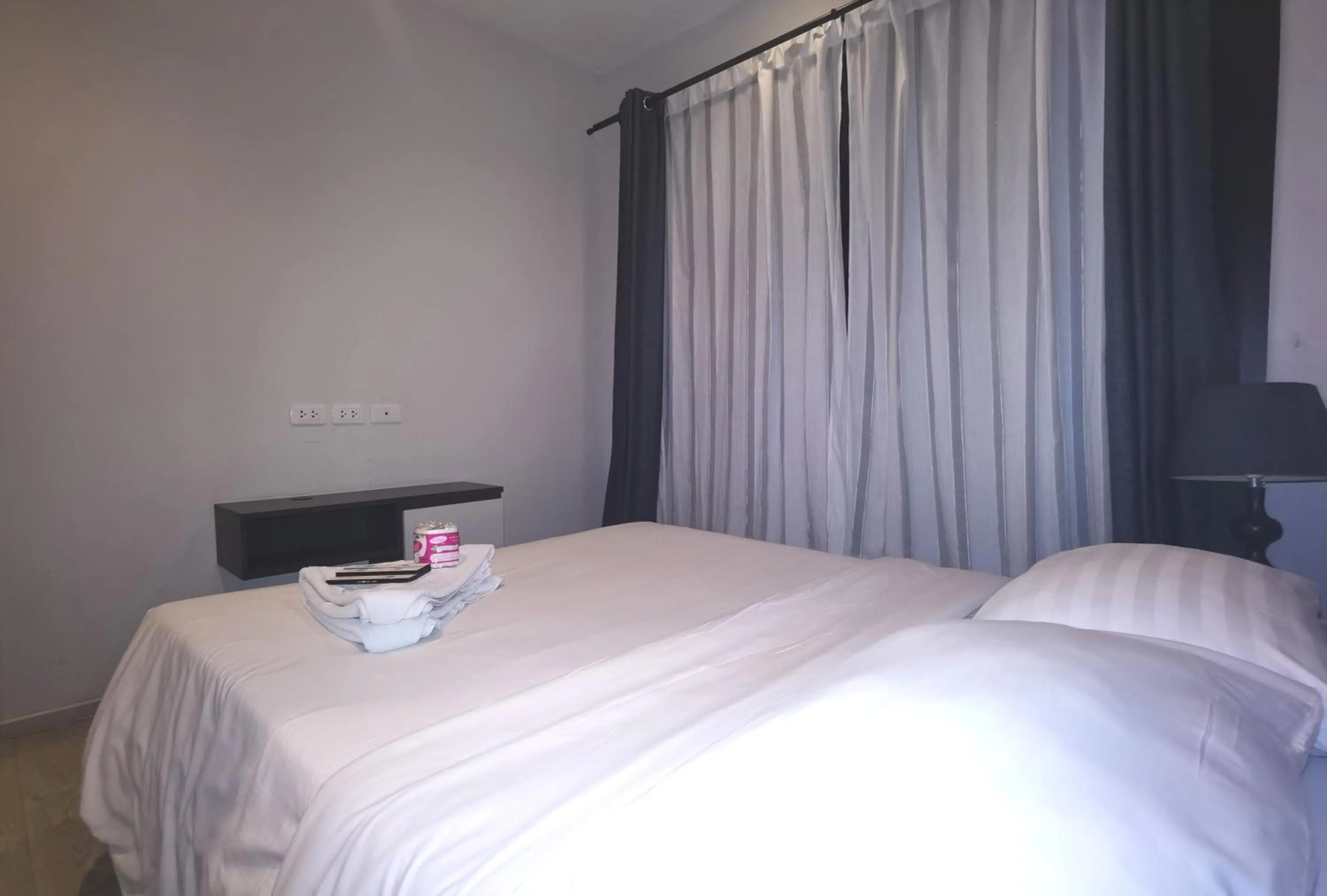 Bed in LLX Apartments at The Base condo