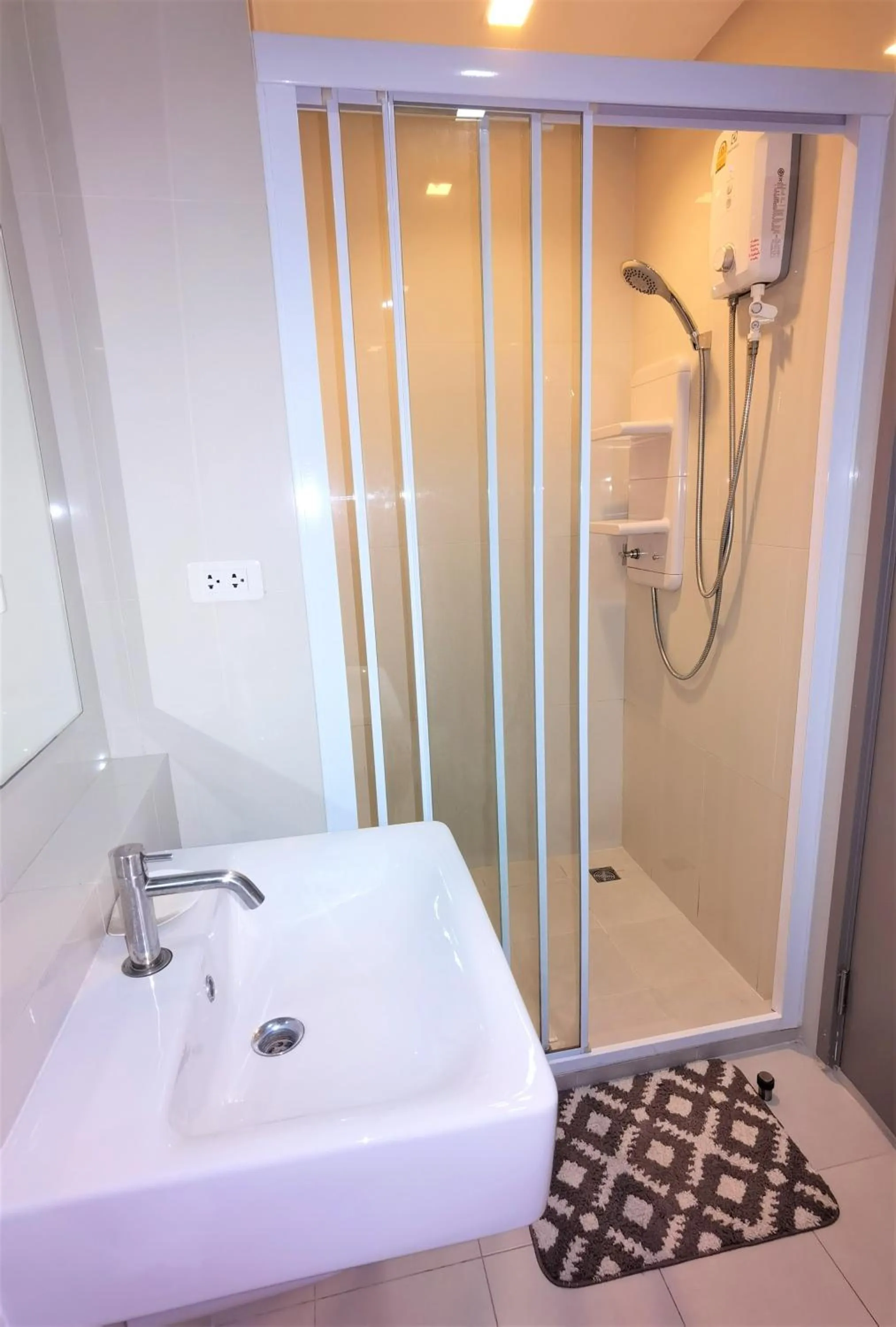 Shower in LLX Apartments at The Base condo
