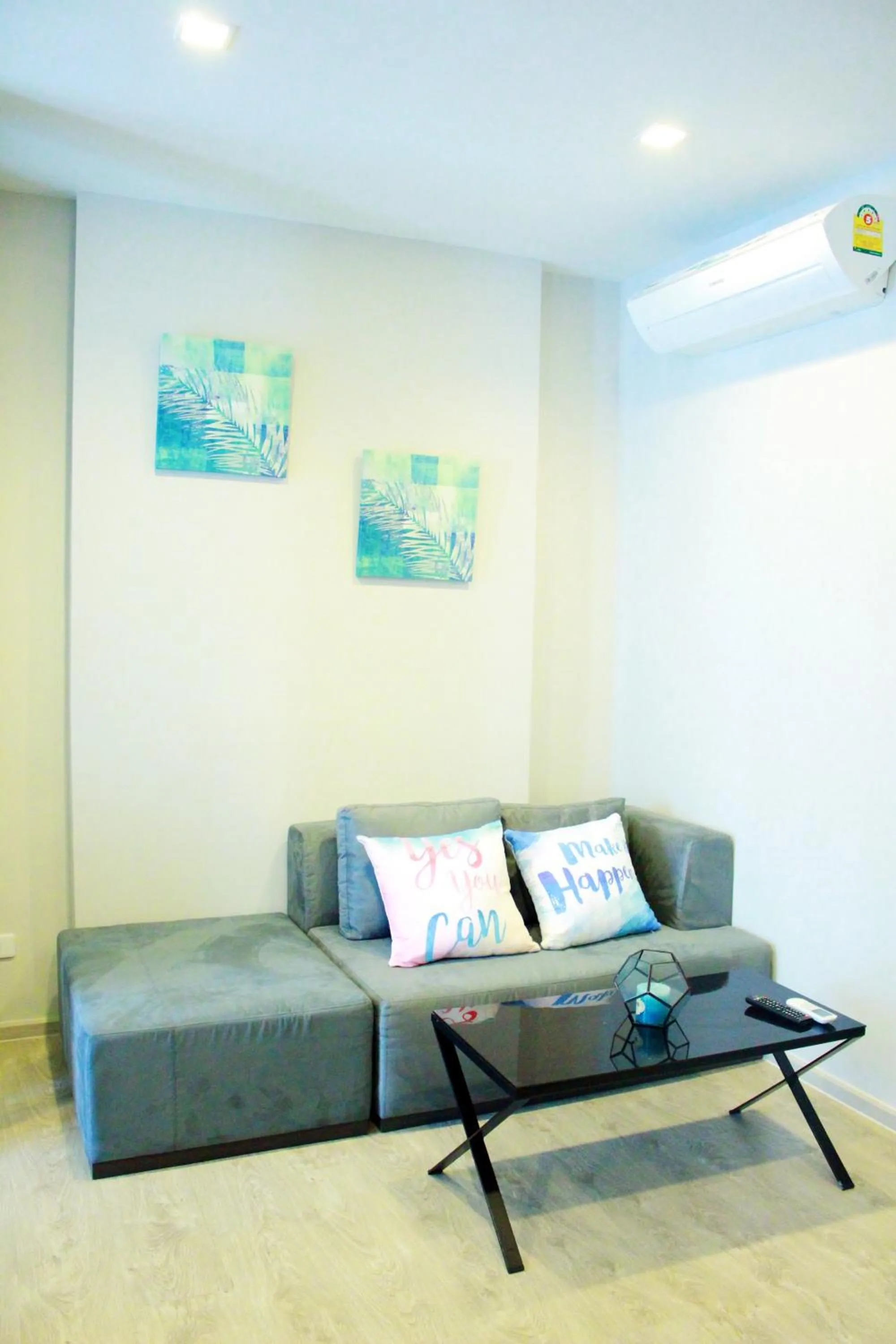 Living room in LLX Apartments at The Base condo