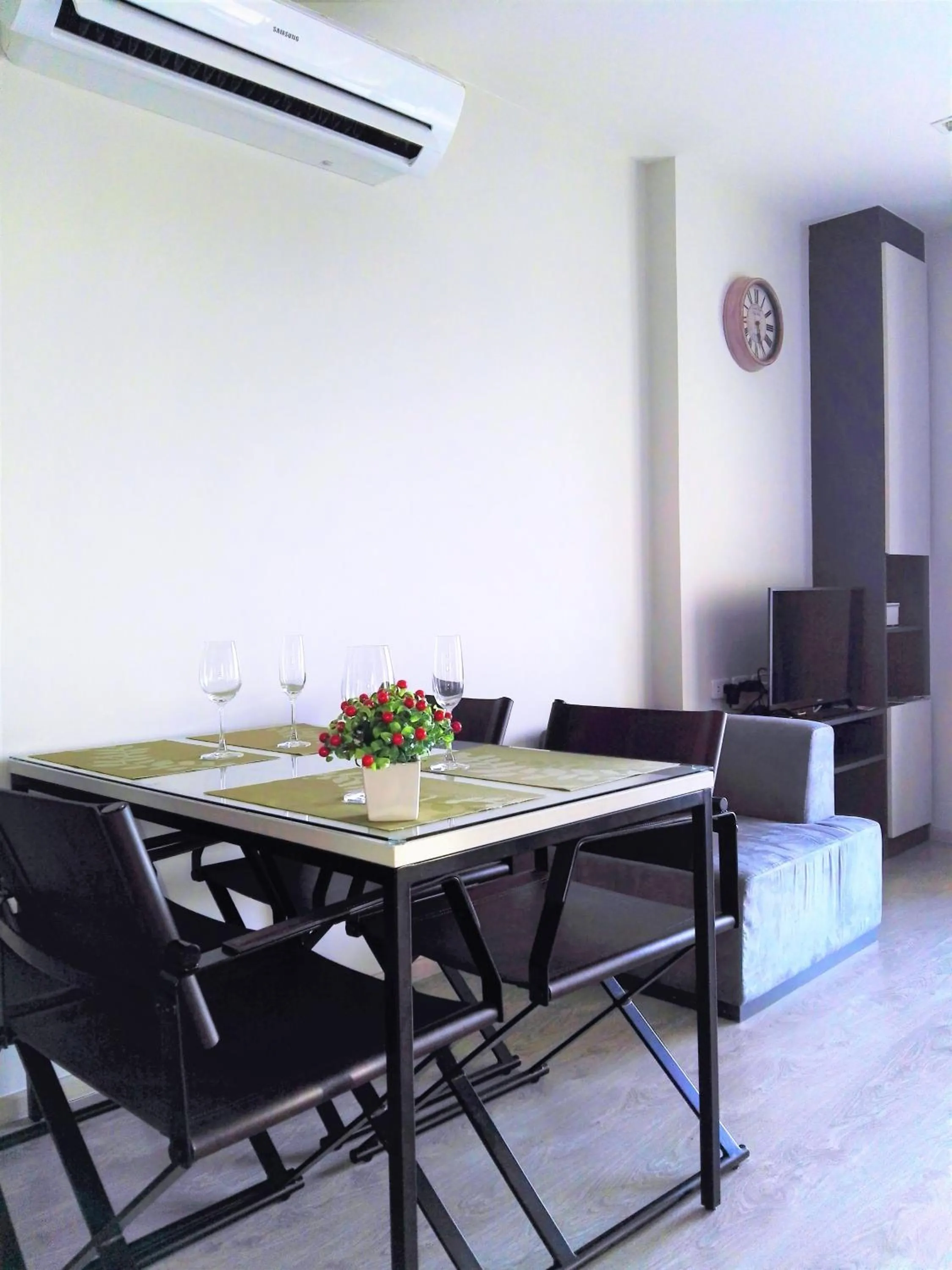 Living room in LLX Apartments at The Base condo