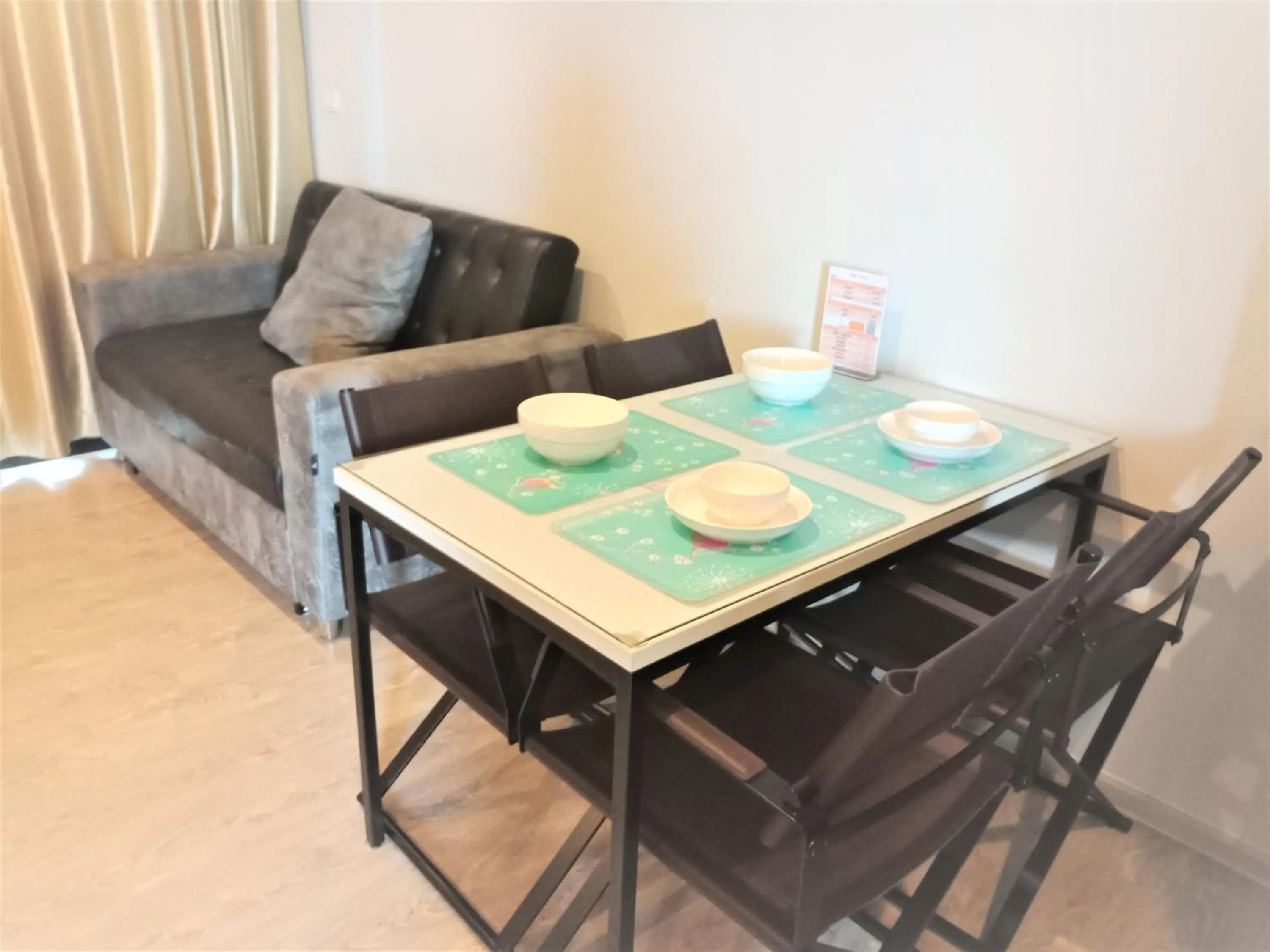 Dining area in LLX Apartments at The Base condo