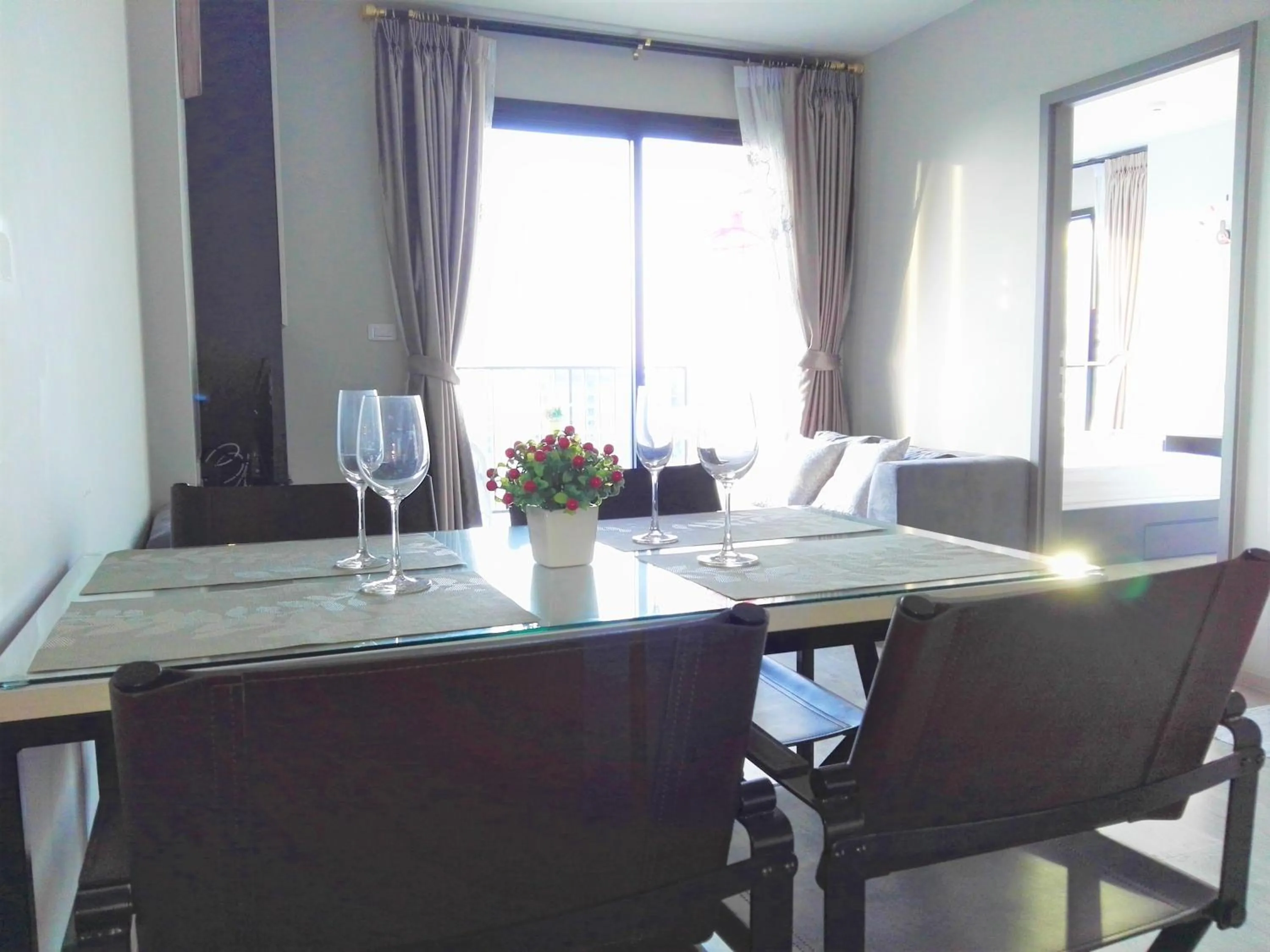 Dining area in LLX Apartments at The Base condo