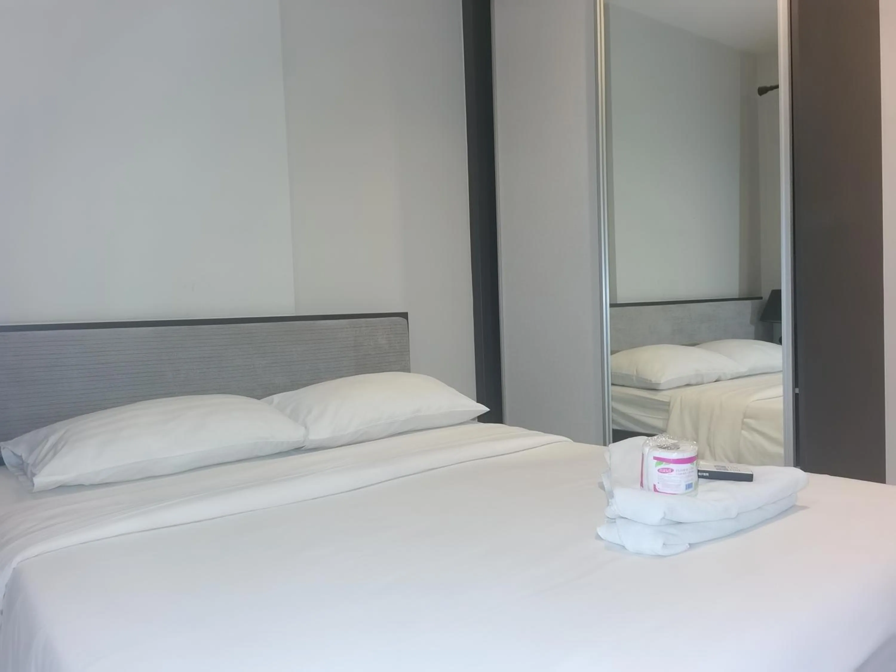 Bed in LLX Apartments at The Base condo