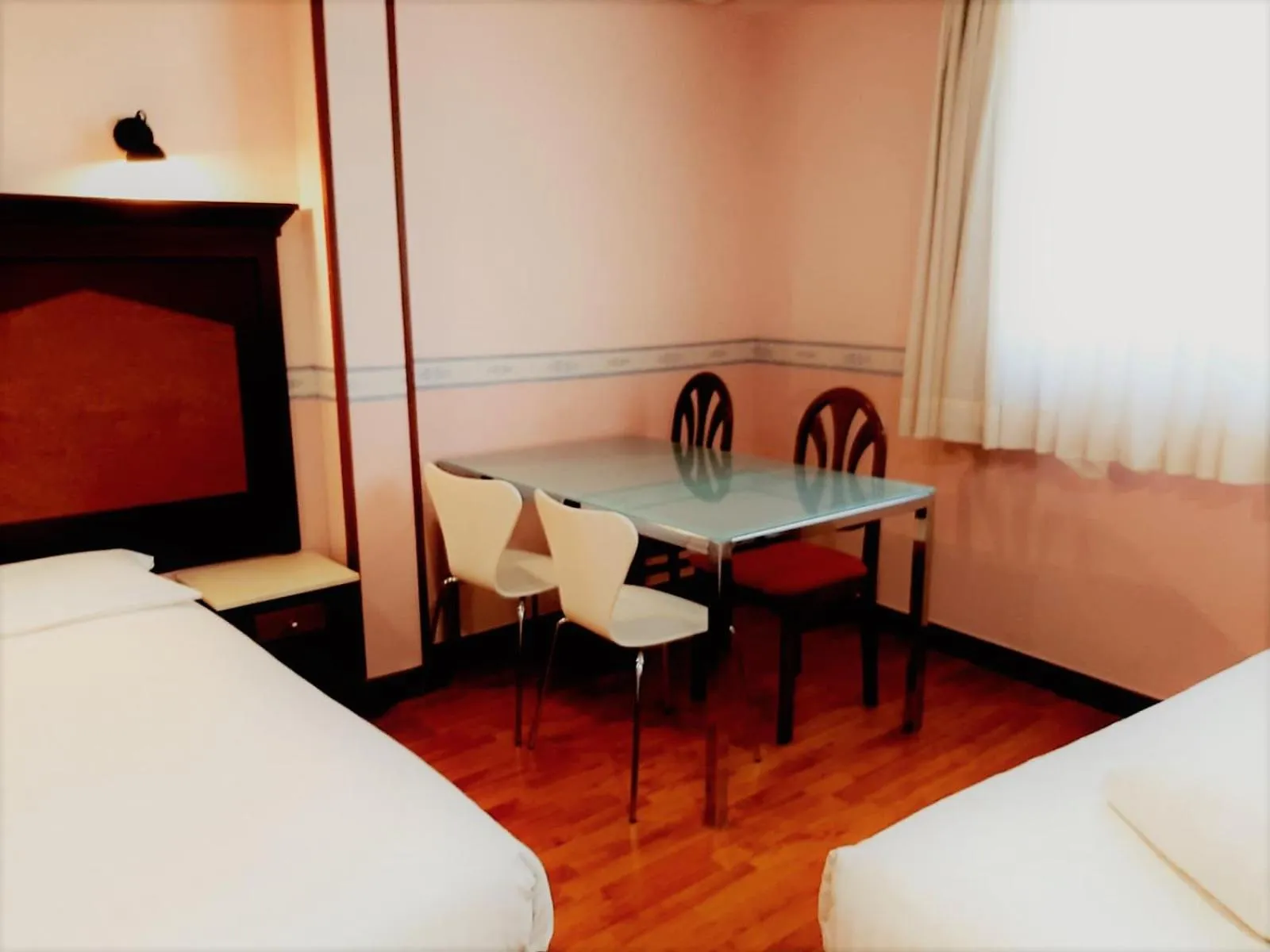 Seating area, Bed in Hosteria Sara by gaiarooms