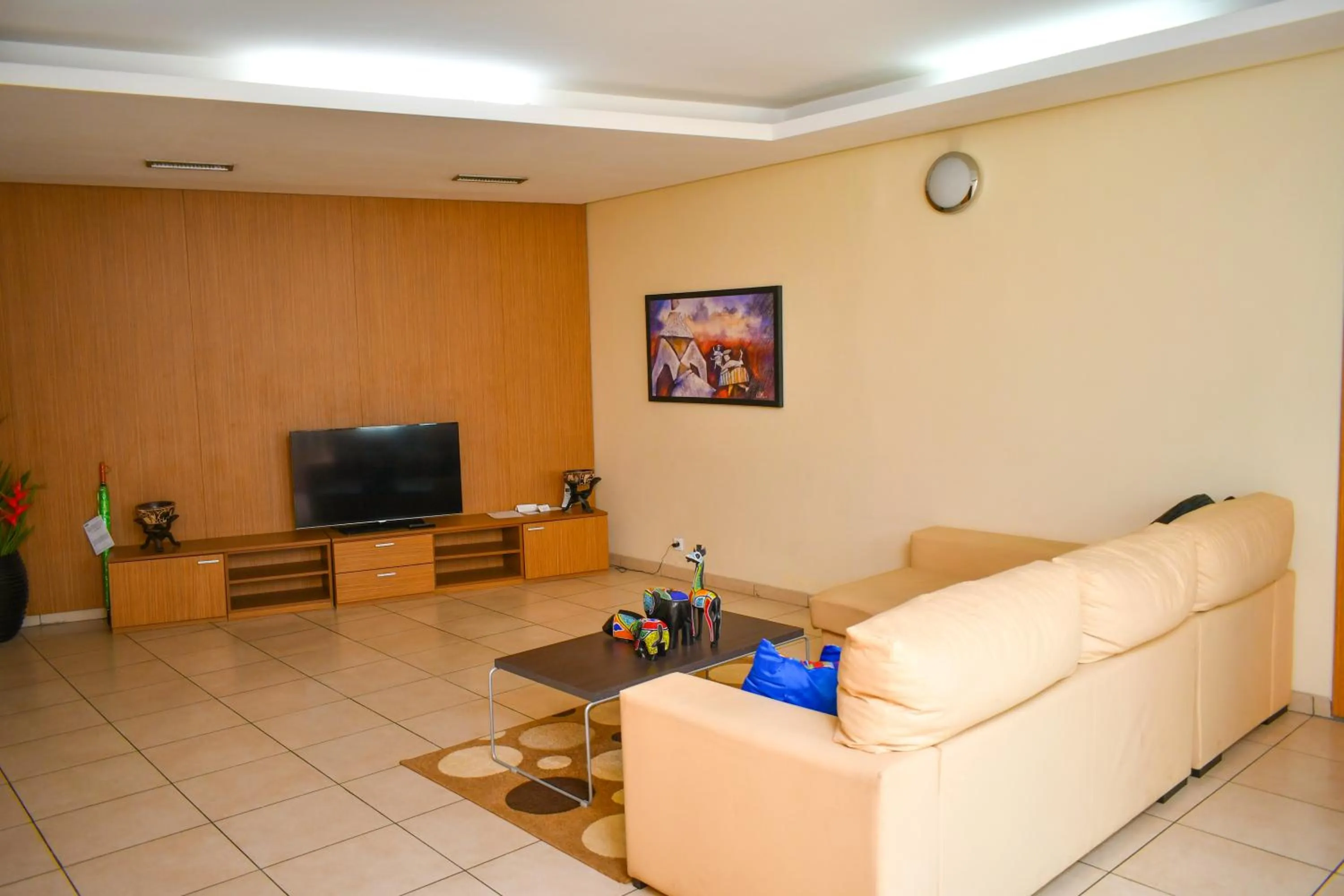 Communal lounge/ TV room in Palm Club Hotel