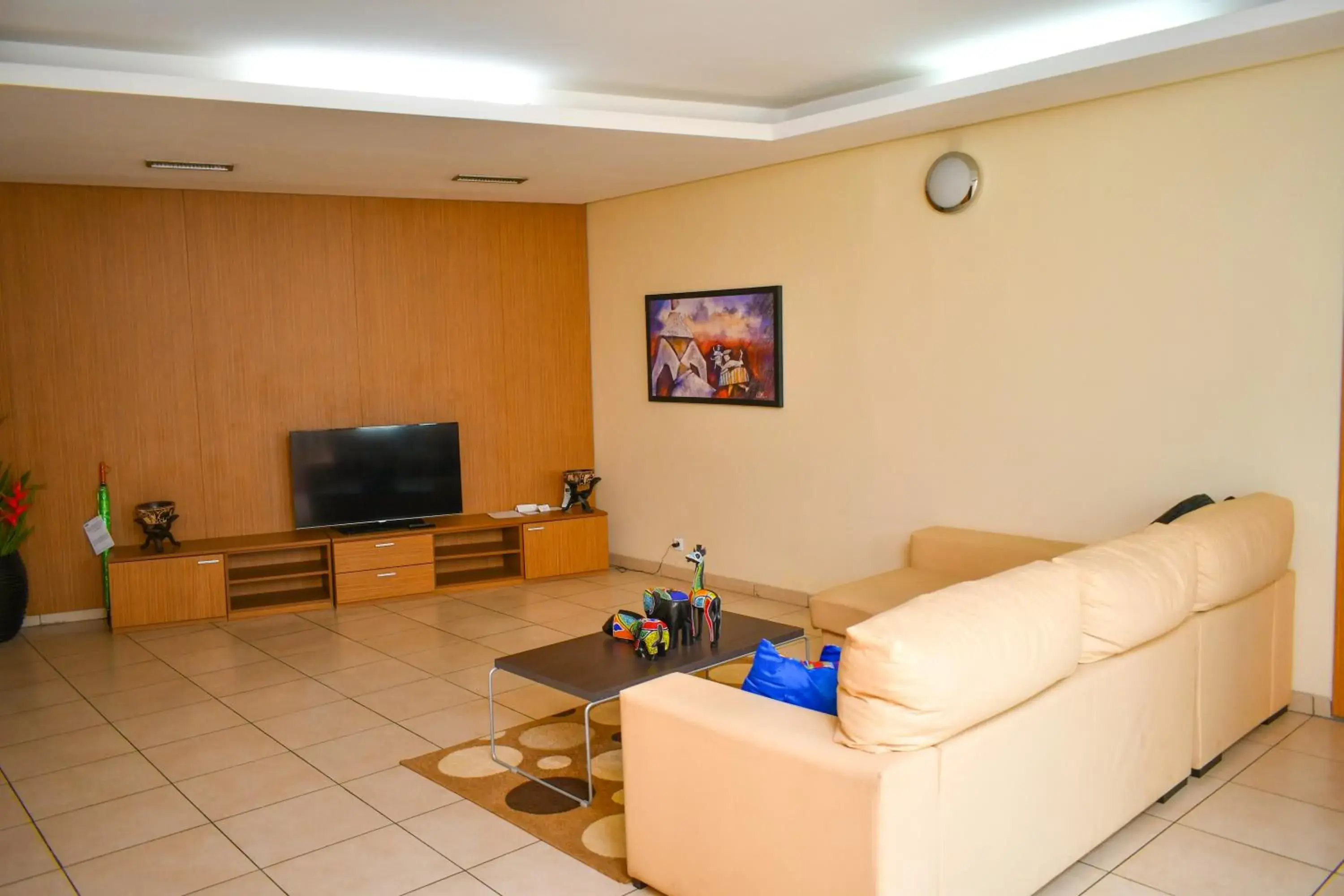 Communal lounge/ TV room in Palm Club Hotel Communal lounge/ TV room in Palm Club Hotel