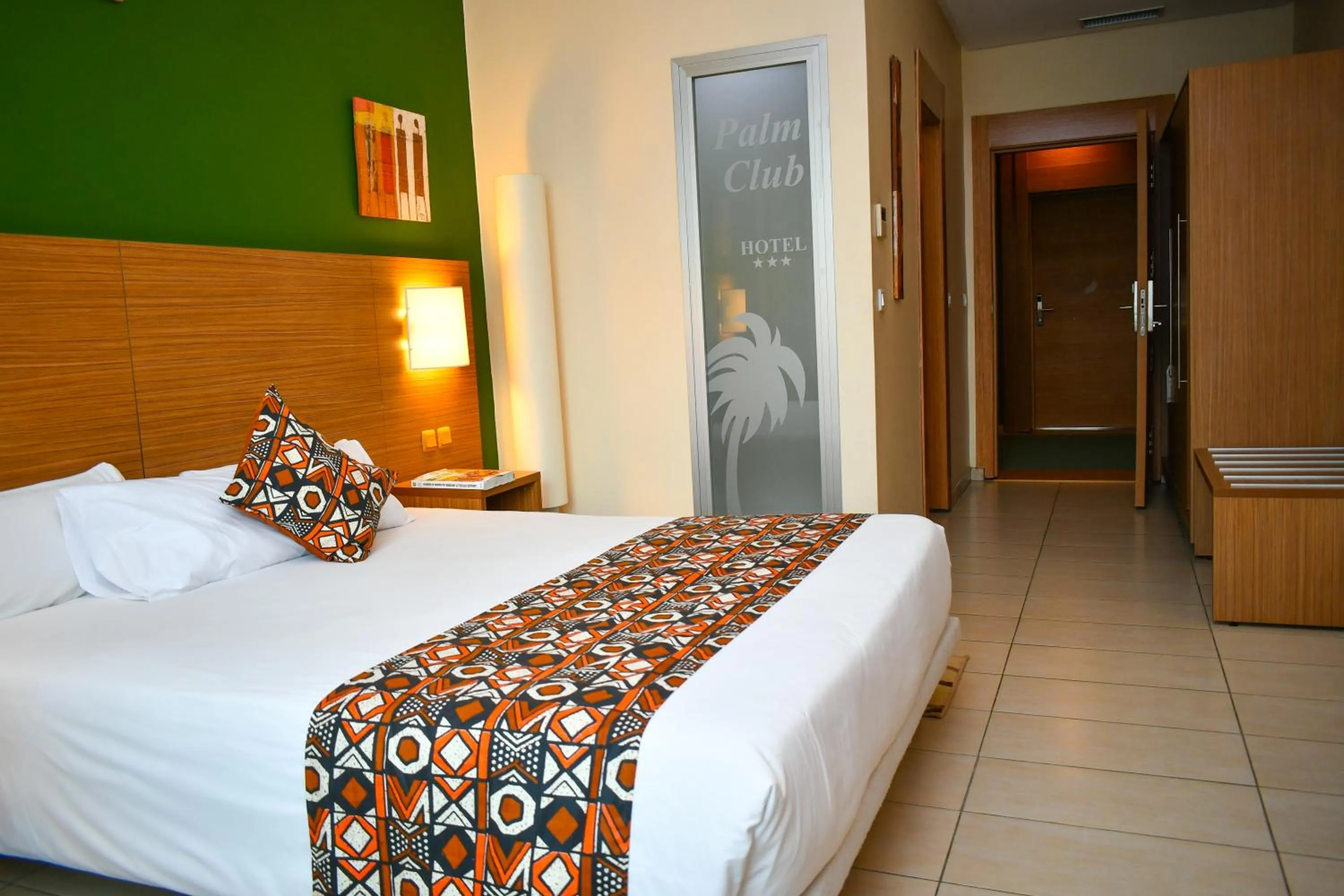 Bed in Palm Club Hotel