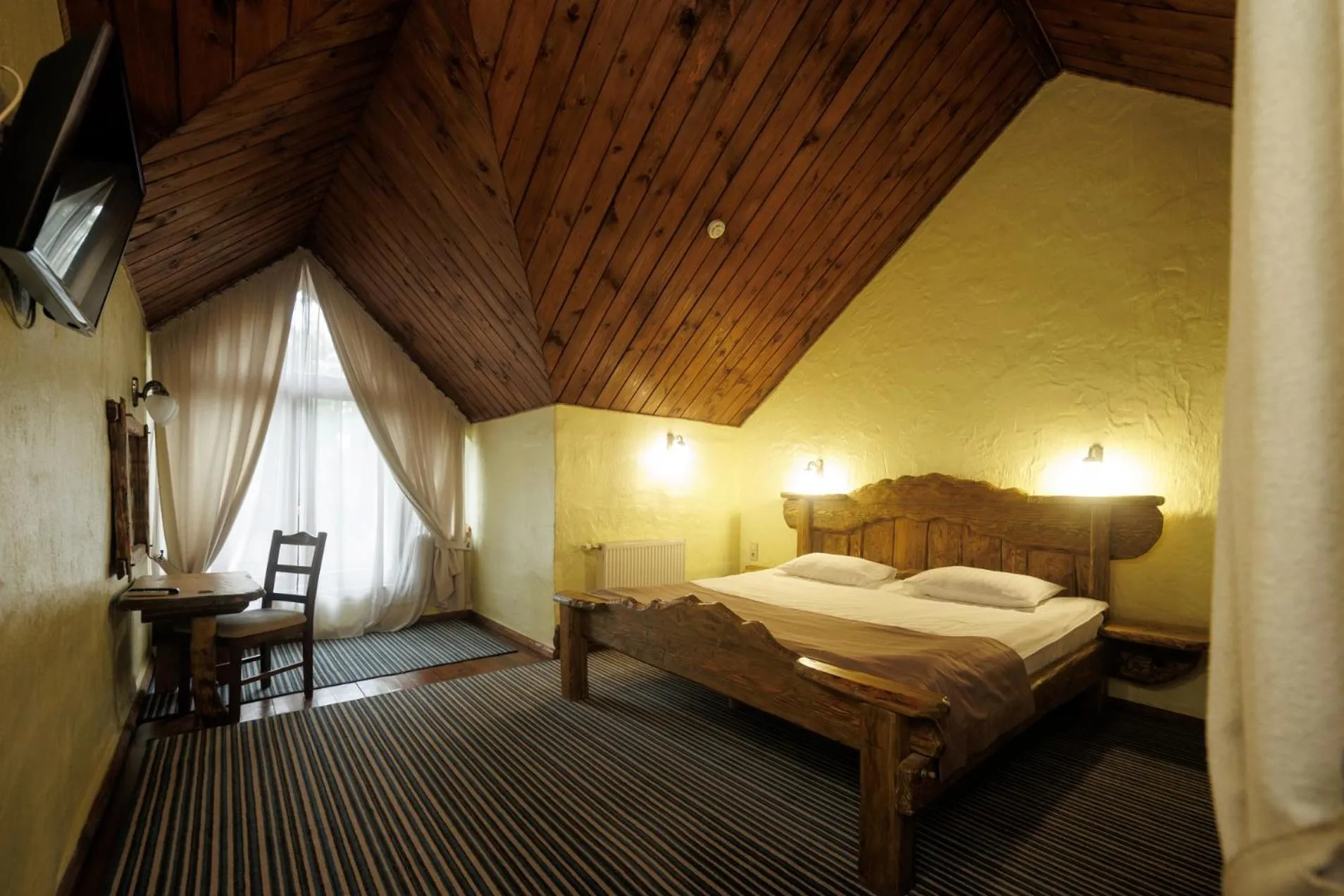 Communal lounge/ TV room, Bed in Drevny Grad Park-hotel