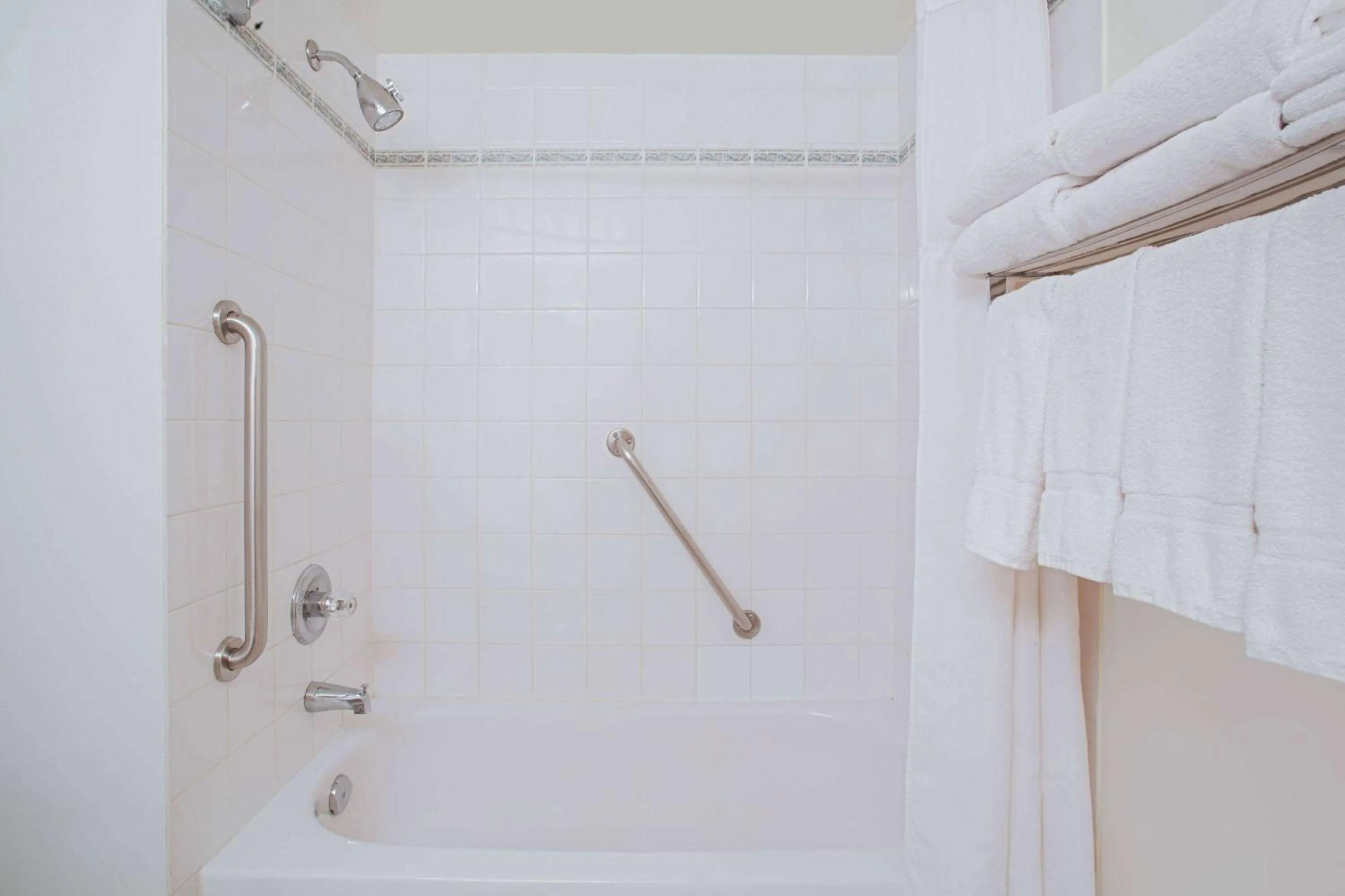 Bathroom in Ramada by Wyndham Red Deer Hotel & Suites