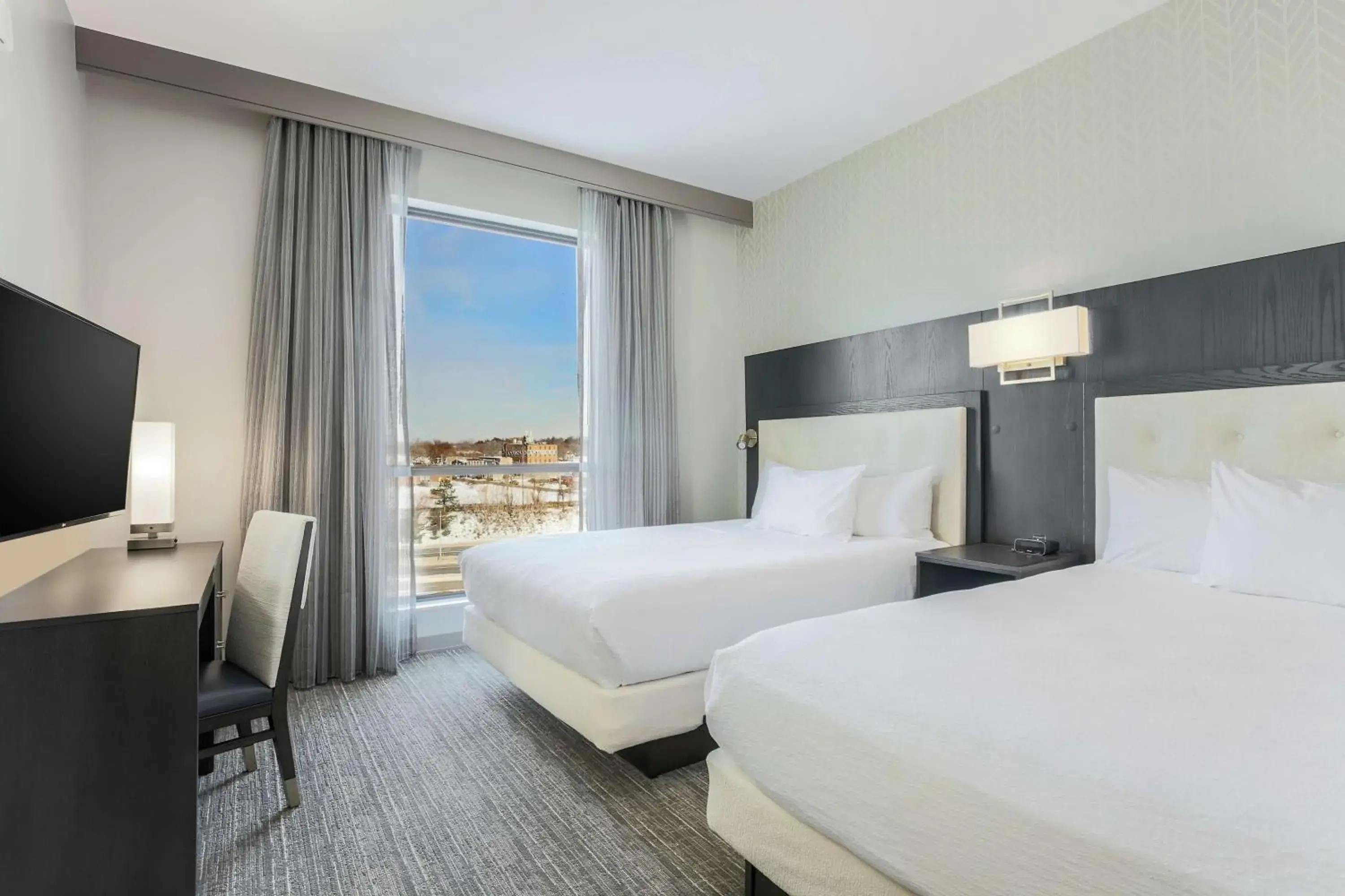 Queen Corner Suite with Two Queen Beds in Embassy Suites By Hilton Syracuse Destiny USA Queen Corner Suite with Two Queen Beds in Embassy Suites By Hilton Syracuse Destiny USA