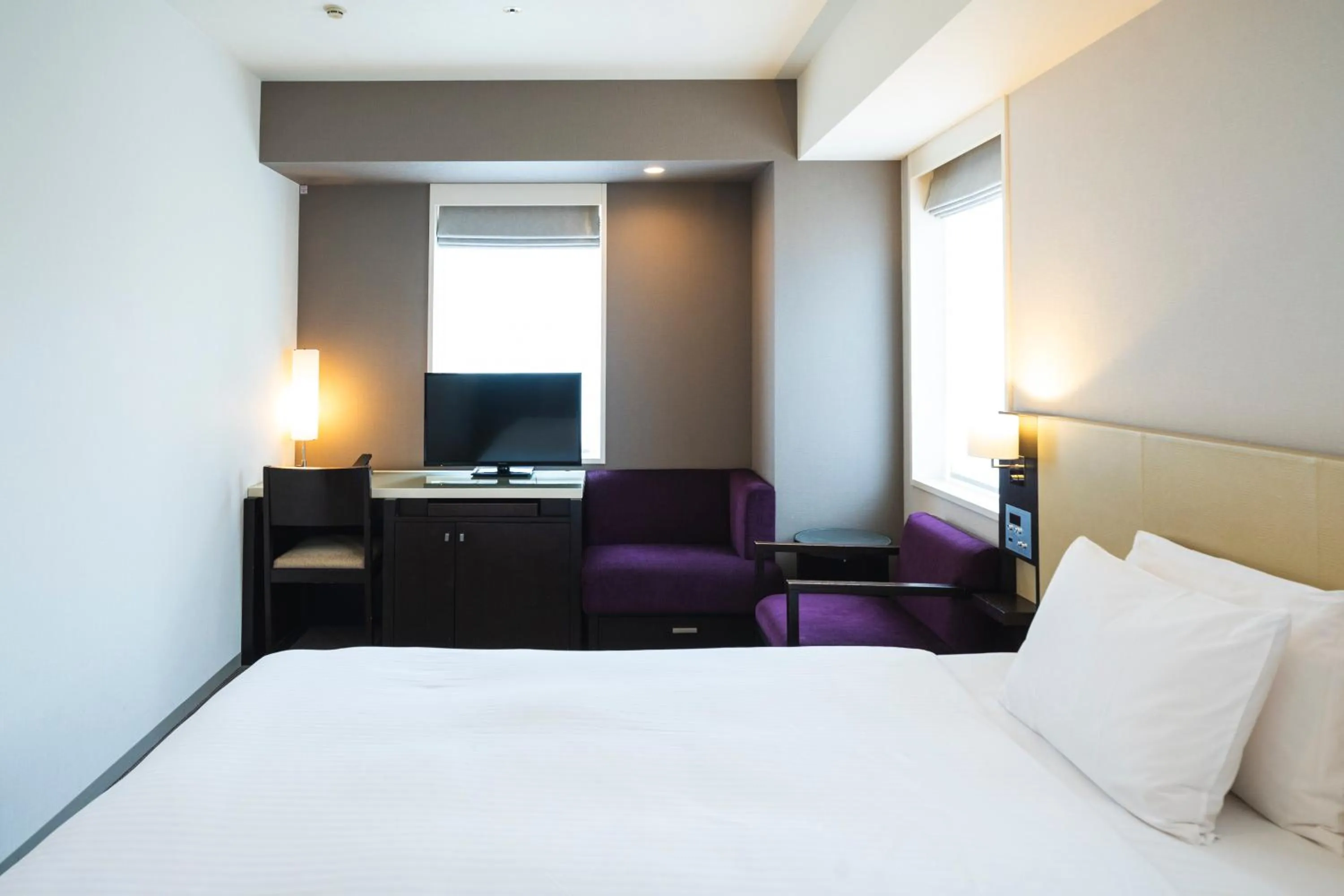 Bed in KOKO HOTEL Kobe Sannomiya