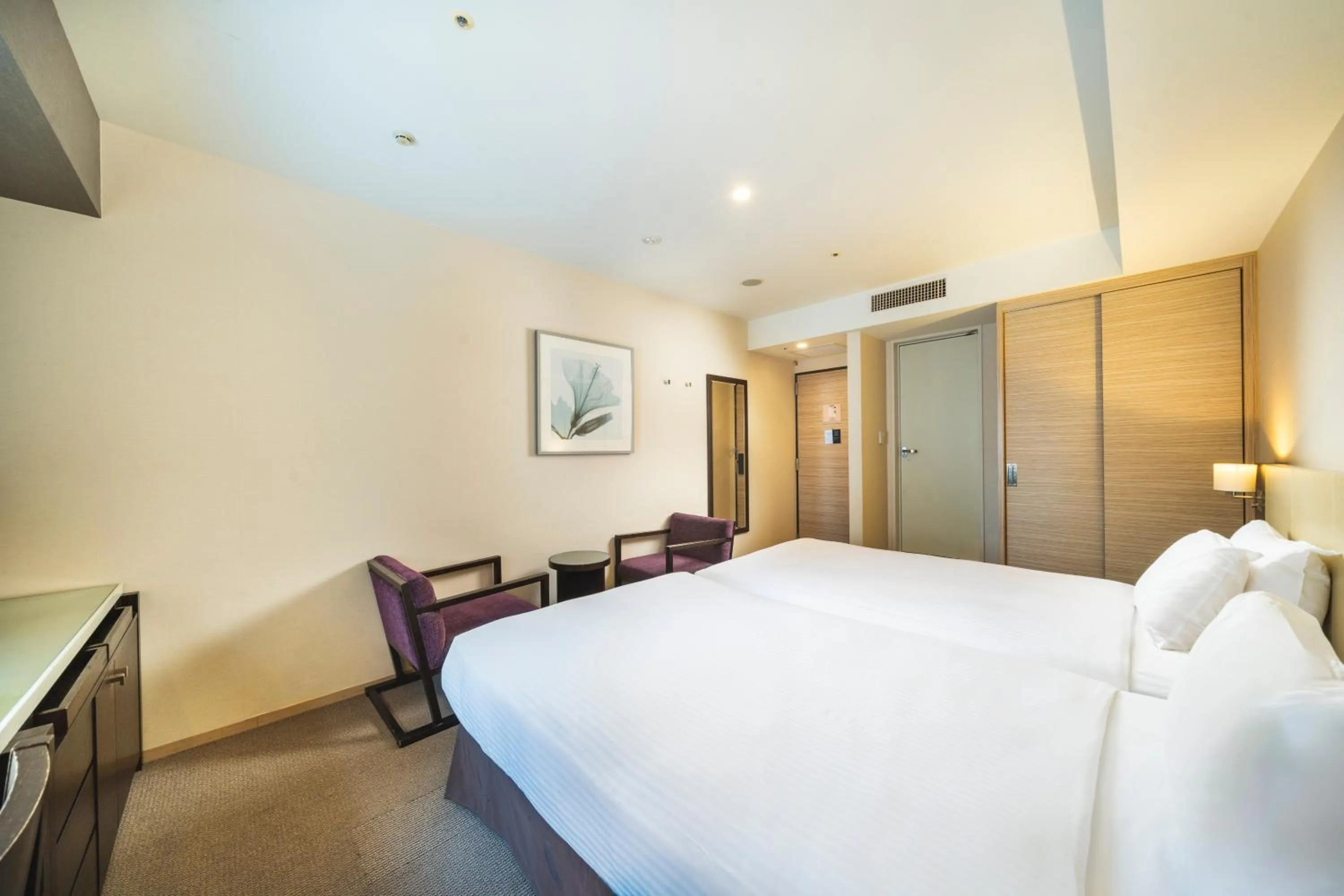 Bed in KOKO HOTEL Kobe Sannomiya