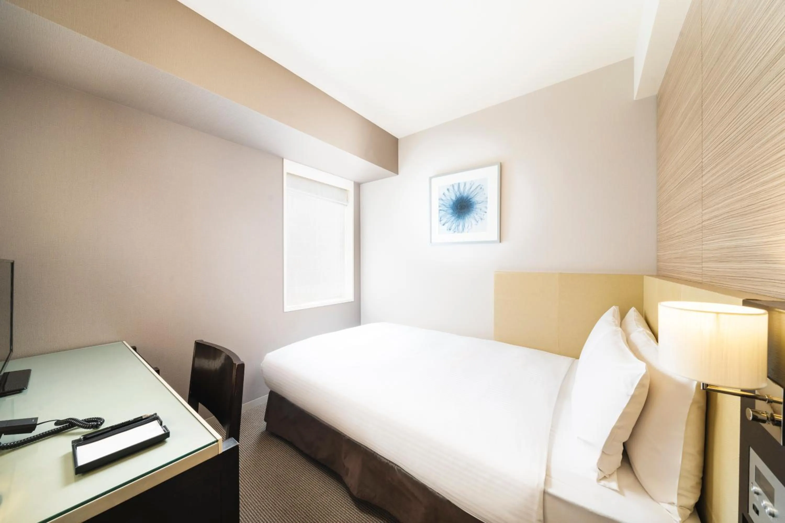 Bed in KOKO HOTEL Kobe Sannomiya