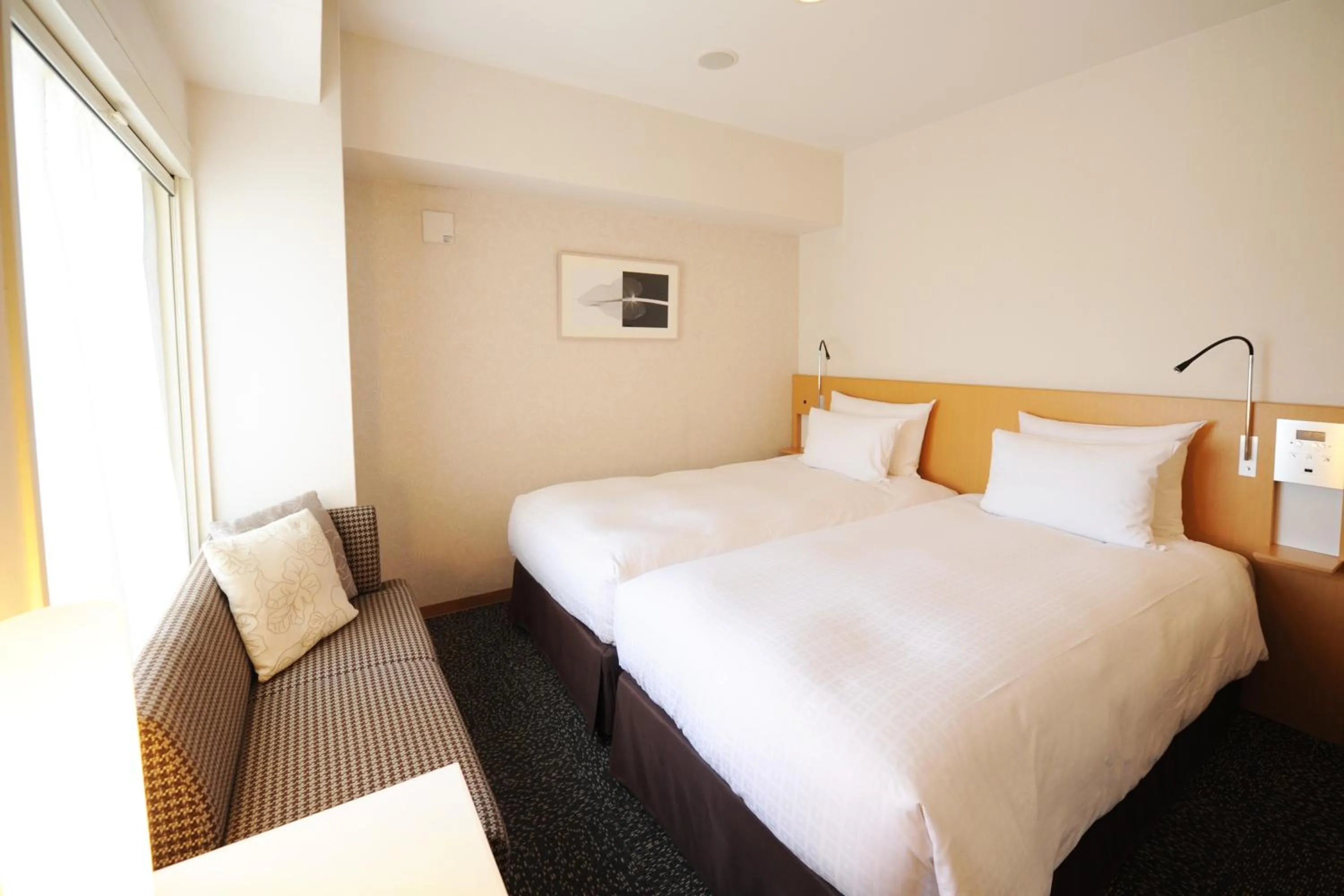 Bed in Hotel Sunflex Kagoshima