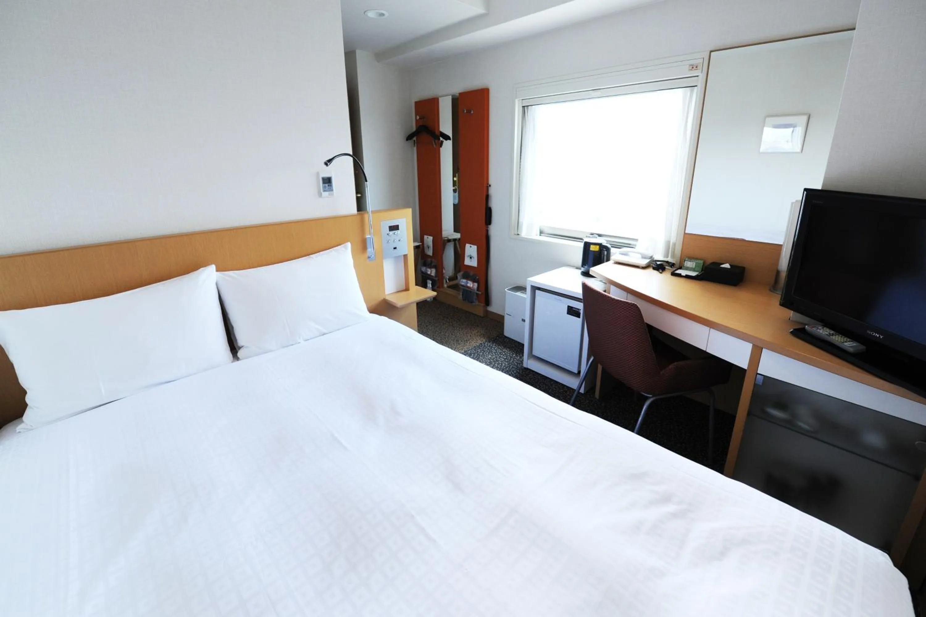Bed in Hotel Sunflex Kagoshima