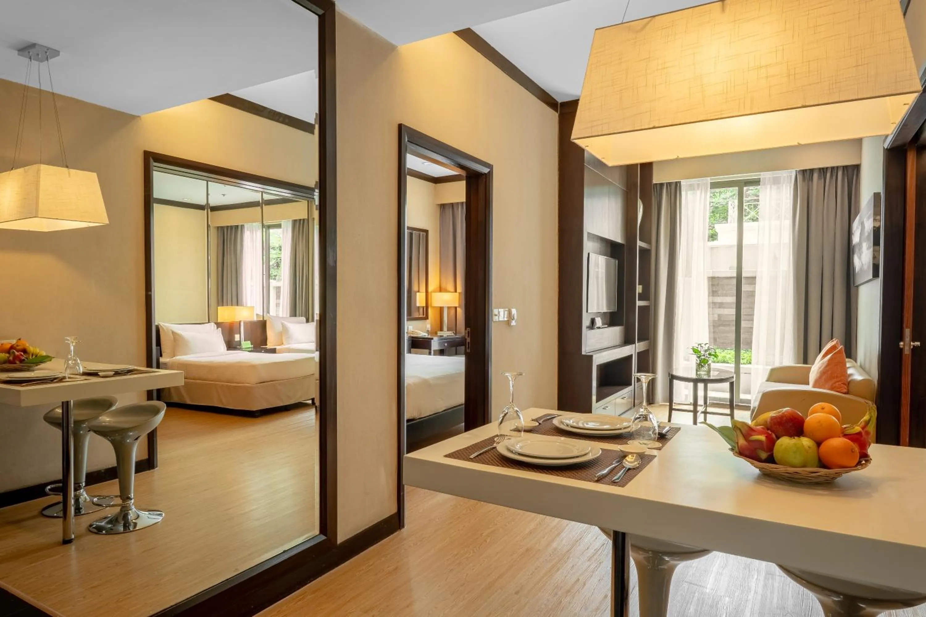 Living room, Bed in Micasa All Suites Hotel