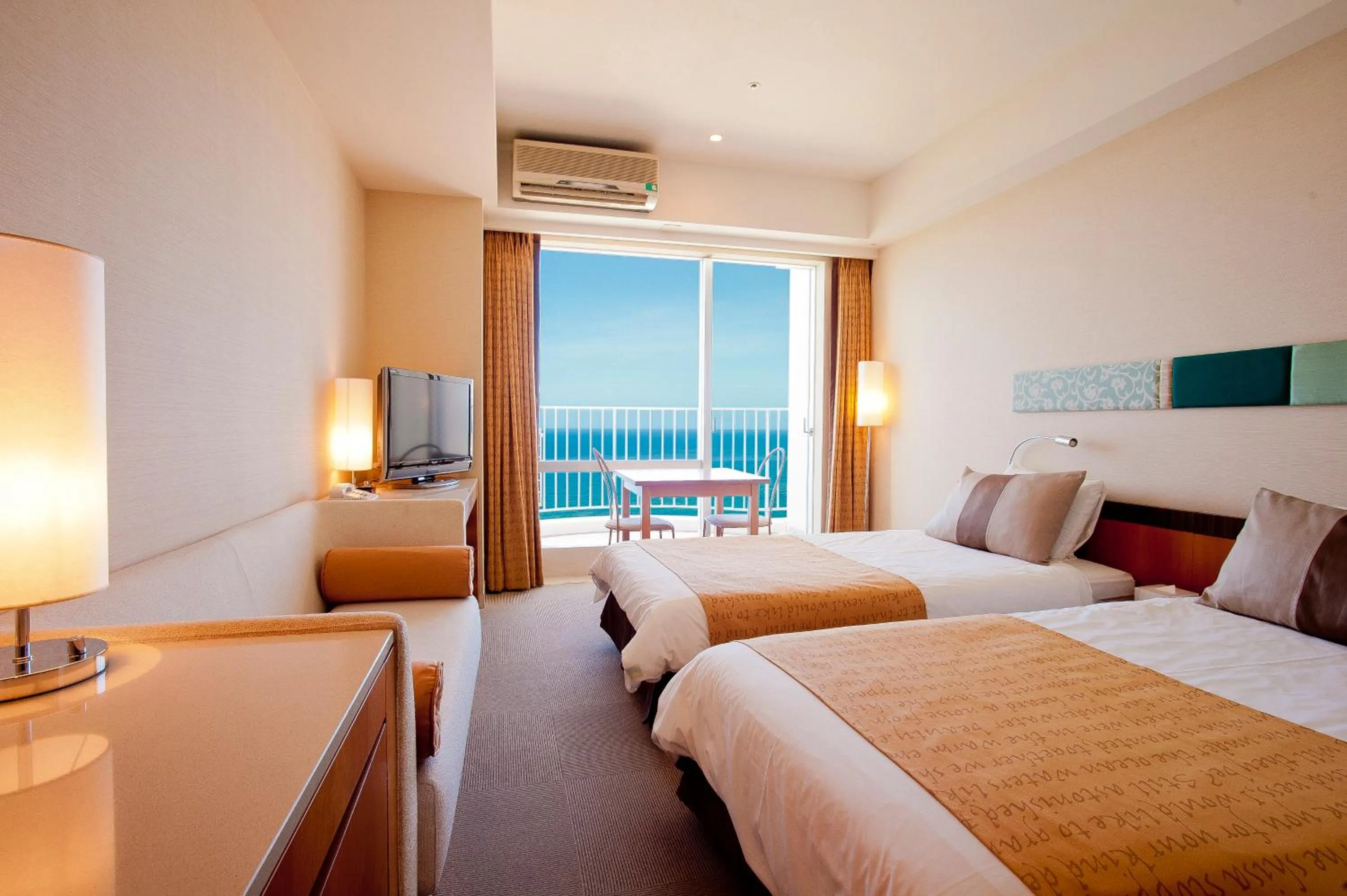 Photo of the whole room, Bed in The Beach Tower Okinawa