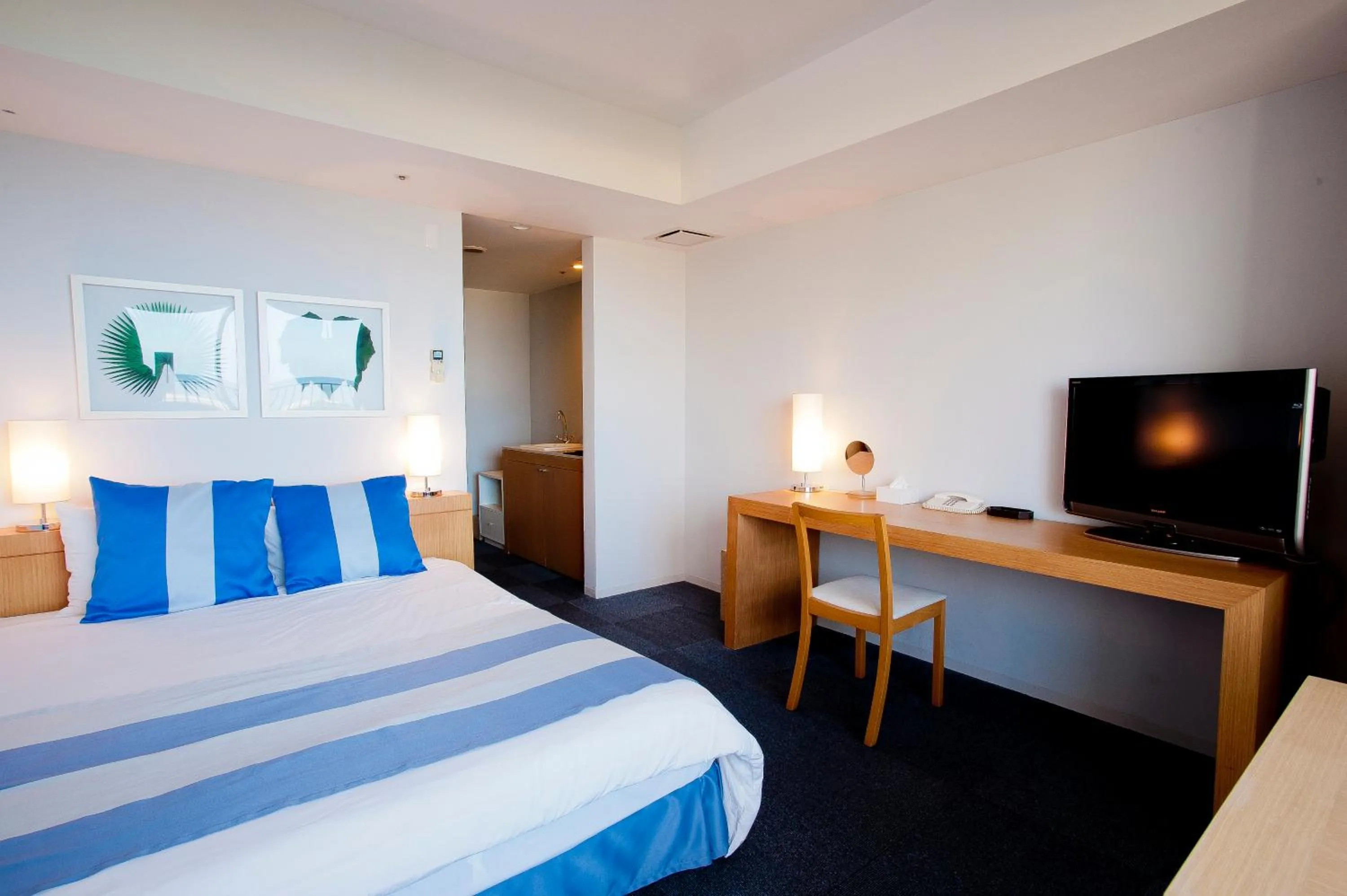 Photo of the whole room, Bed in The Beach Tower Okinawa