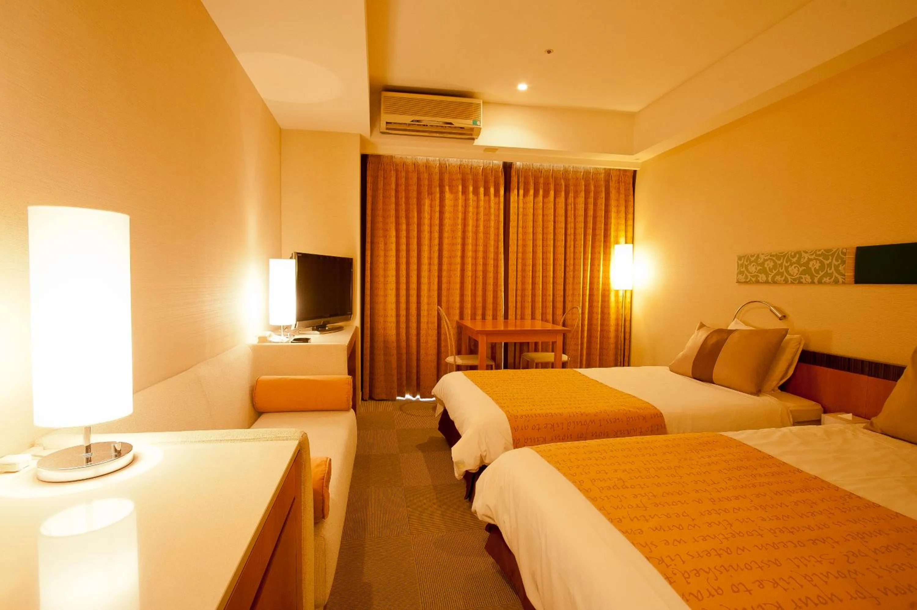 Photo of the whole room, Bed in The Beach Tower Okinawa