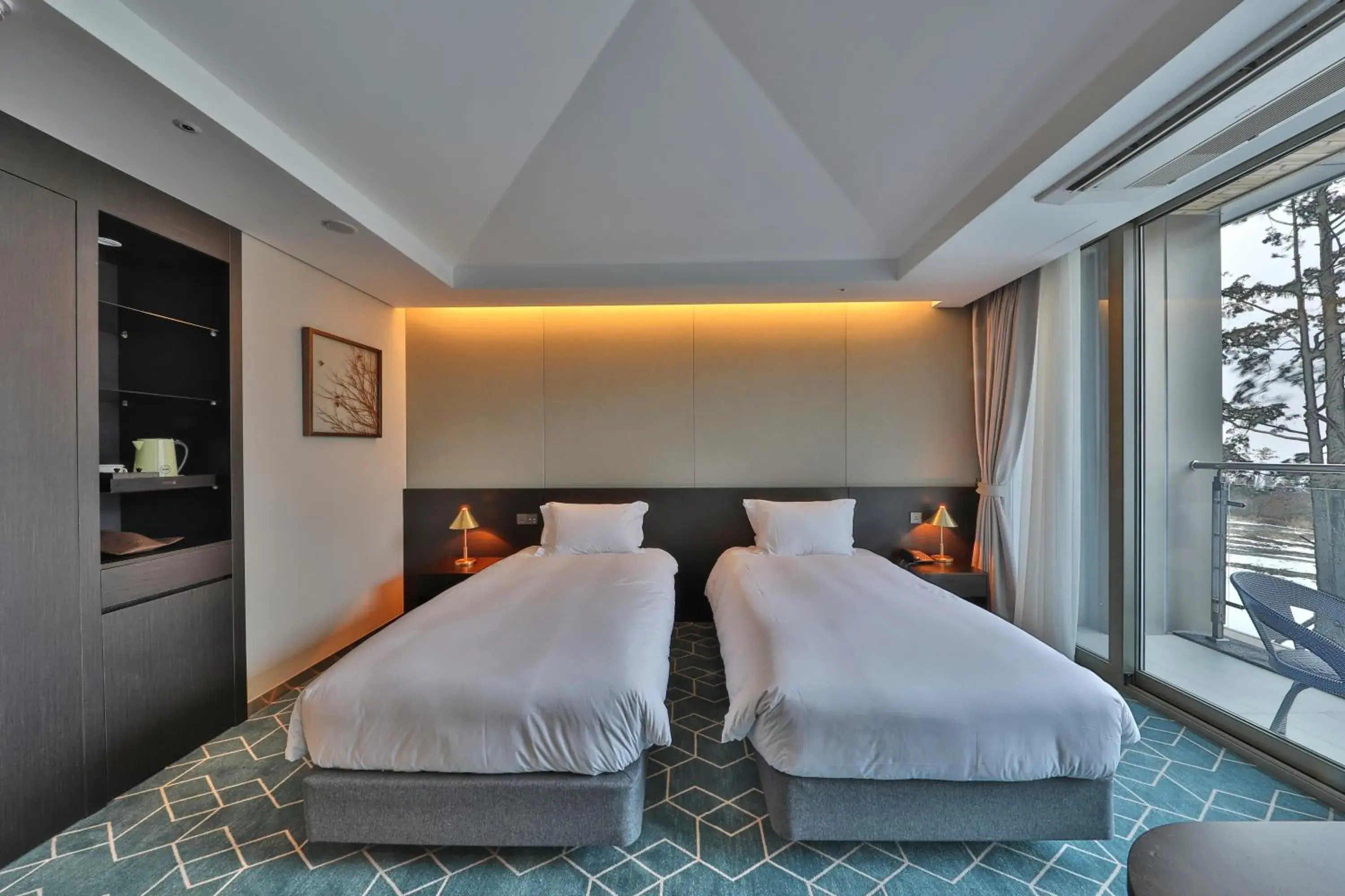 Bed in Camphortree Hotel and Resort Bed in Camphortree Hotel and Resort